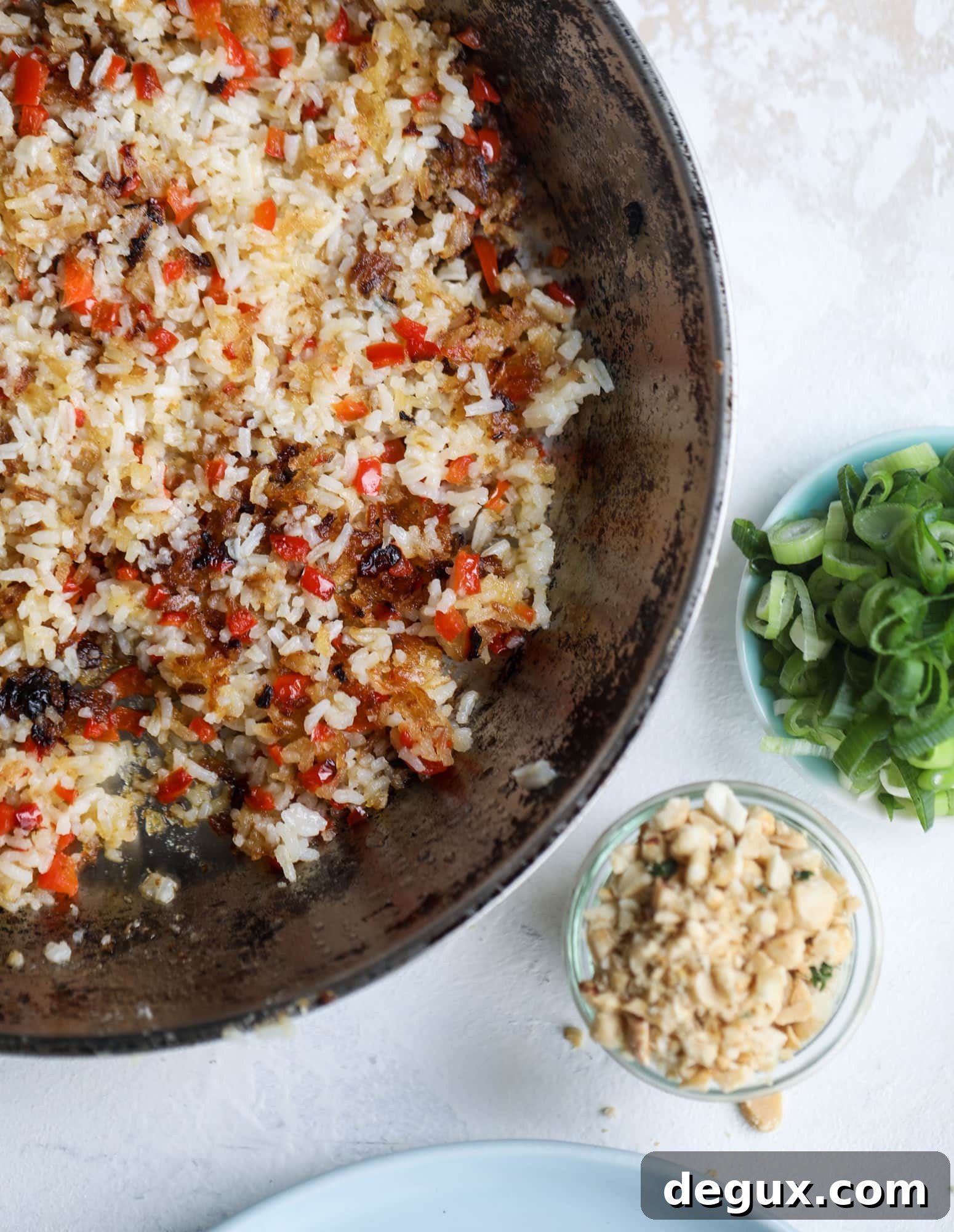This crispy rice salad is the best lunch I've had in ages! It's full of crunch and crisp, it's satisfying and has lots of green kale so we get our veg in. The crispy rice salad can be a meal, you can add beans or rice or it can even be a side dish. I howsweeteats.com #rice #salad #vegetarian #crispy #kale
