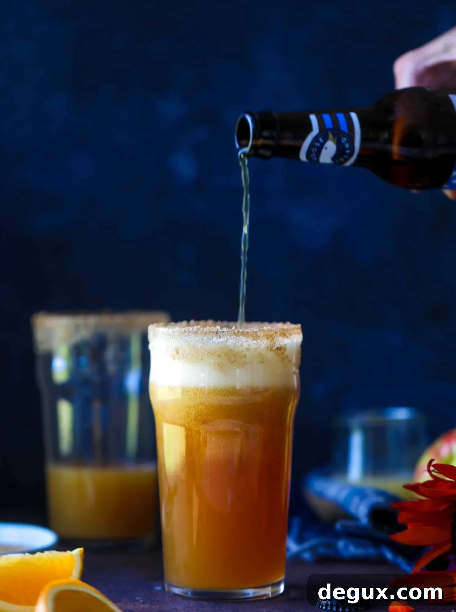 This apple cider shandy recipes is perfect for the fall season! Apple cider, sparkling cider and your favorite beer come together in an icy glass to create the best flavor ever. Finished with a cinnamon sugar rim, there's nothing better! I howsweeteats.com #apple #cider #shandy #cocktails #beer