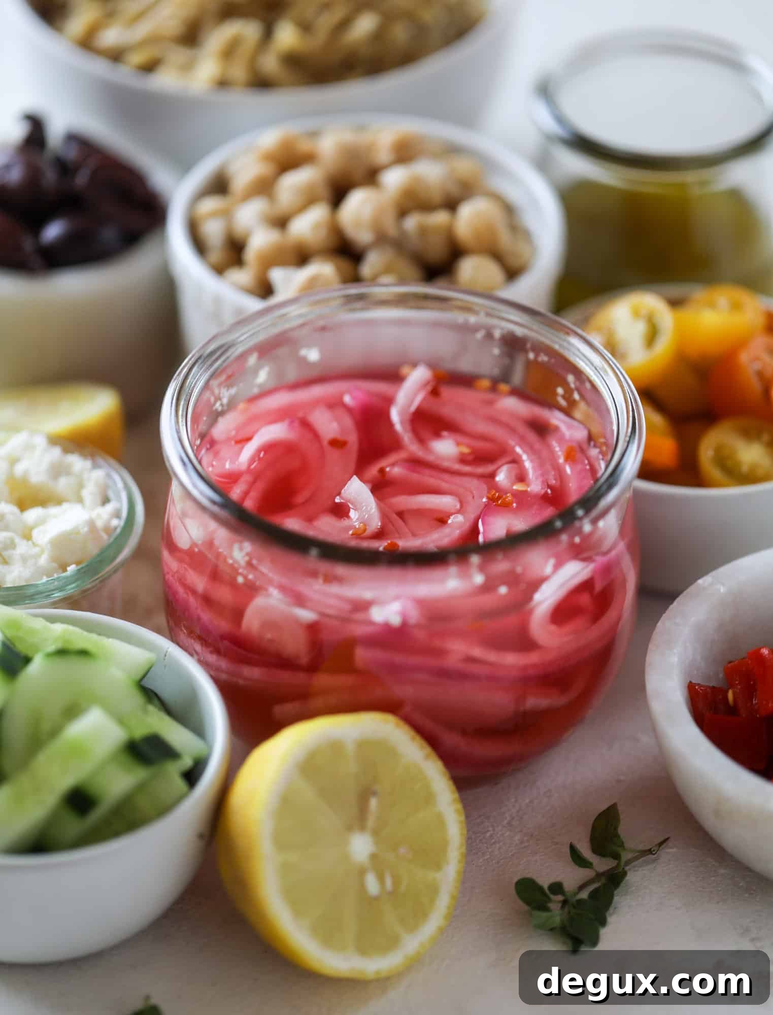 This incredible greek orzo salad in a jar is to die for! The recipe is so easy and flavorful, super satisfying and perfect for meal prep. This salad in a jar is a delicious lunch idea for the weekdays and keeps you feeling full and happy! I howsweeteats.com #salad #jar #greek #orzo #recipes #healthy #lunch #mealprep