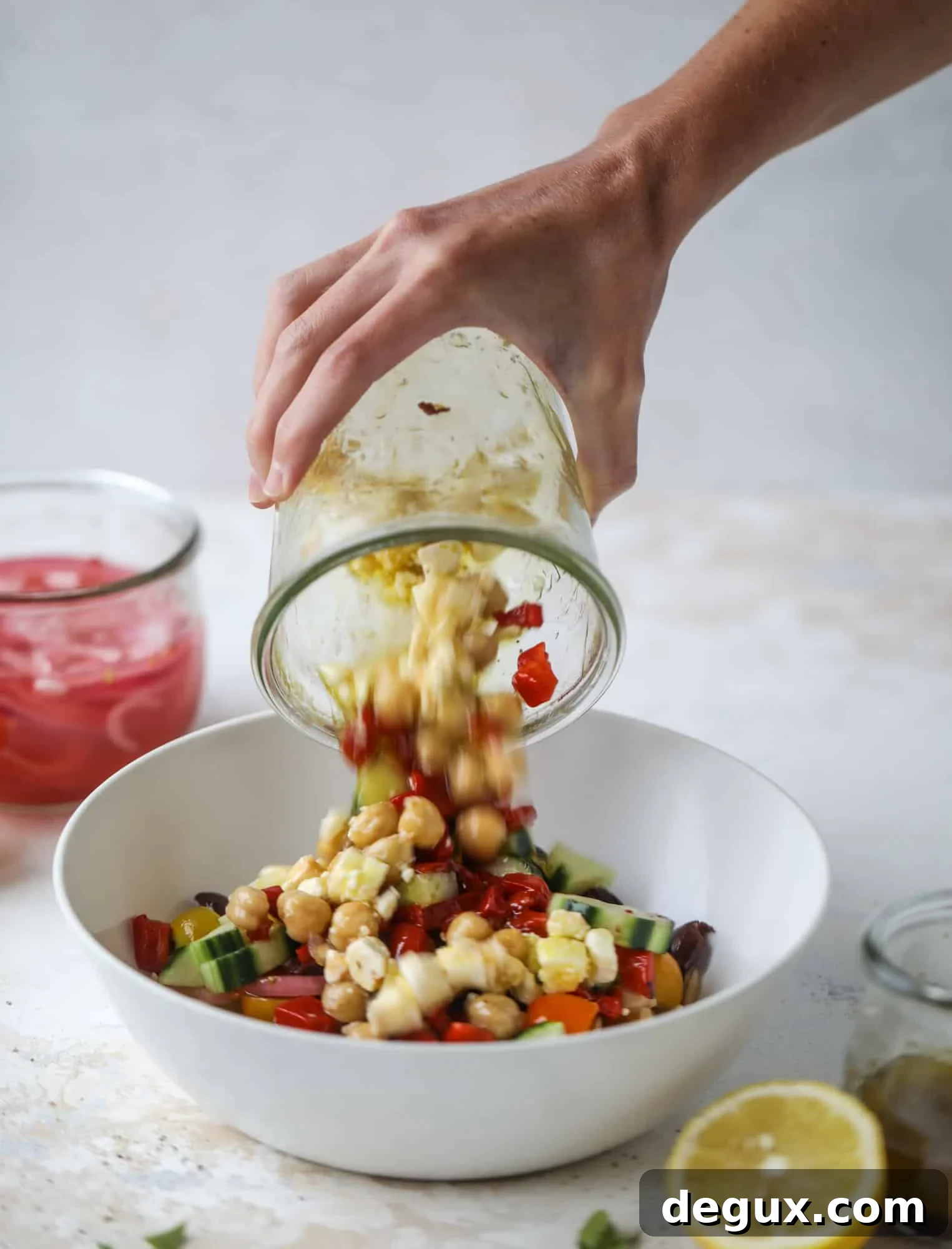 This incredible greek orzo salad in a jar is to die for! The recipe is so easy and flavorful, super satisfying and perfect for meal prep. This salad in a jar is a delicious lunch idea for the weekdays and keeps you feeling full and happy! I howsweeteats.com #salad #jar #greek #orzo #recipes #healthy #lunch #mealprep