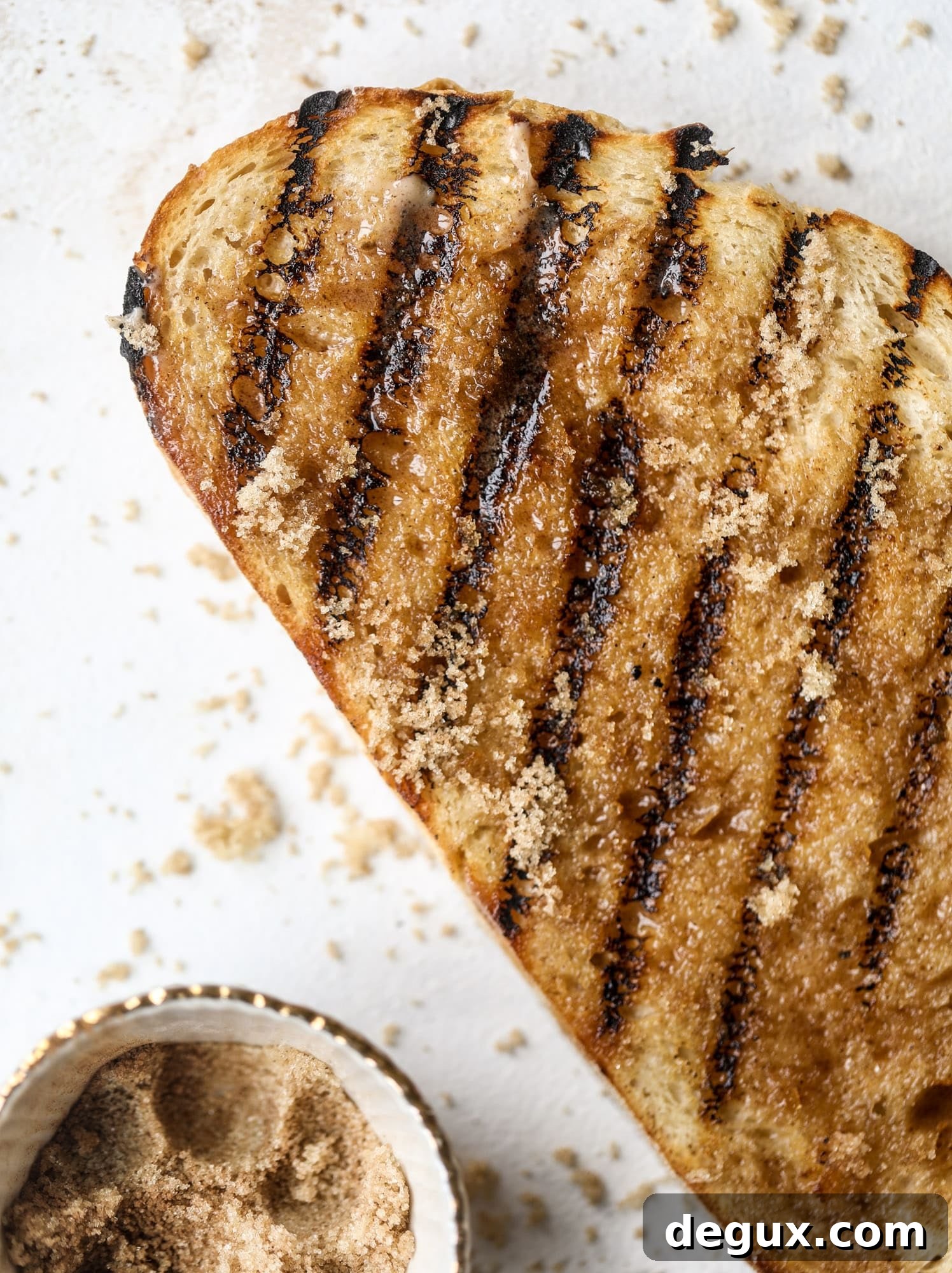 Grilled Cinnamon Toast with Fig Slices and Creamy Ricotta 5 This cinnamon sugar toast is an absolutely dream! It's spread with a cinnamon brown sugar butter, grilled to perfection and served with creamy whipped ricotta cheese, fresh figs, honey, cinnamon and sliced almonds. I howsweeteats.com #cinnamon #sugar #toast #ricotta #figs #breakfast
