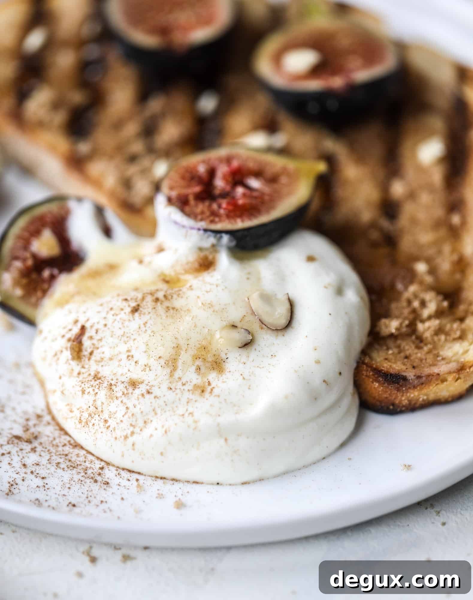 Grilled Cinnamon Toast with Fig Slices and Creamy Ricotta 8 This cinnamon sugar toast is an absolutely dream! It's spread with a cinnamon brown sugar butter, grilled to perfection and served with creamy whipped ricotta cheese, fresh figs, honey, cinnamon and sliced almonds. I howsweeteats.com #cinnamon #sugar #toast #ricotta #figs #breakfast
