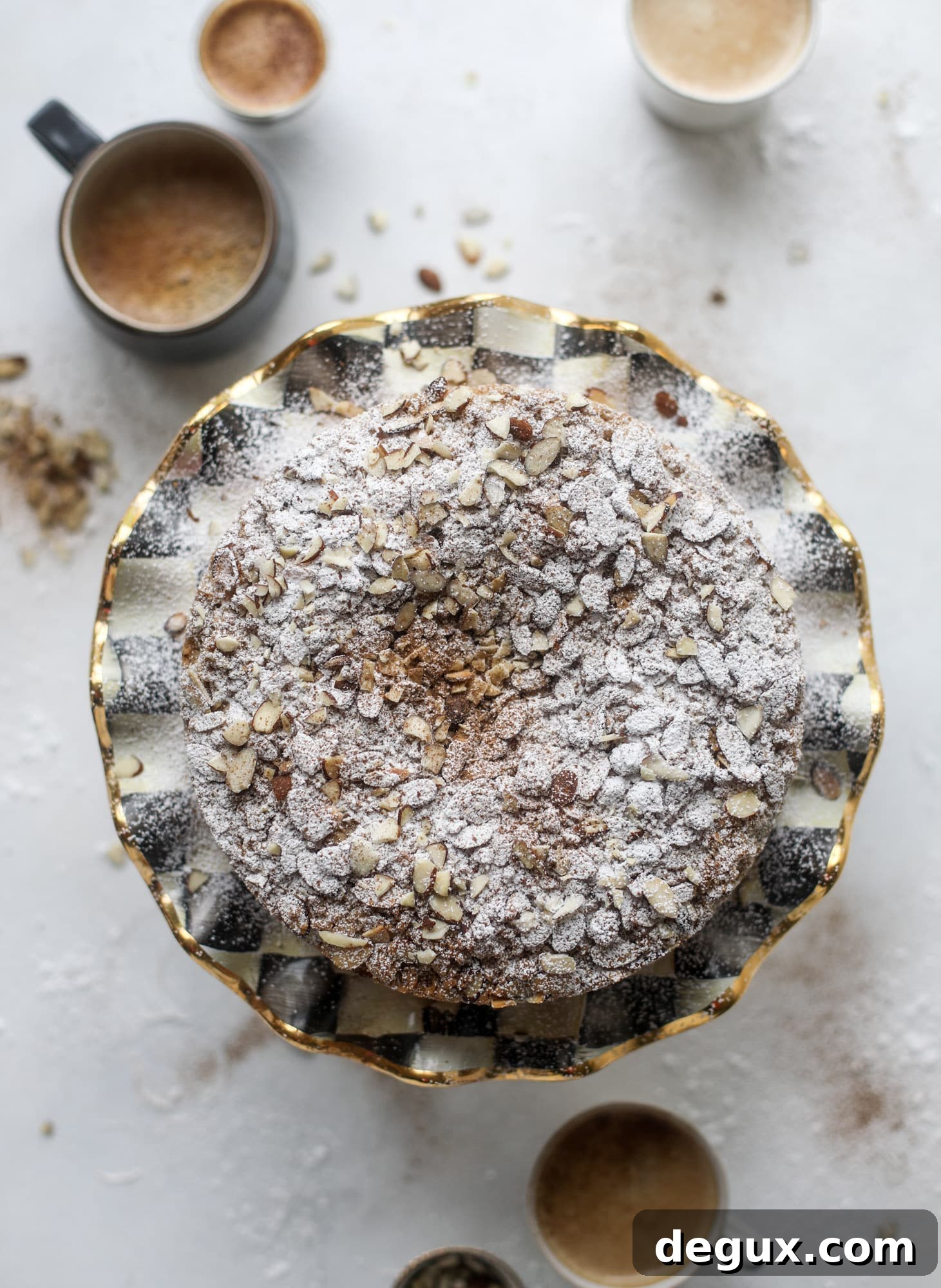 This almond crumb cake is so delicious and perfect for breakfast or dessert! It's full of delicious almond flavor and crunch and the crumb on top is so thick and perfect. It's like an almond croissant on steroids. I howsweeteats.com #almond #crumb #cake