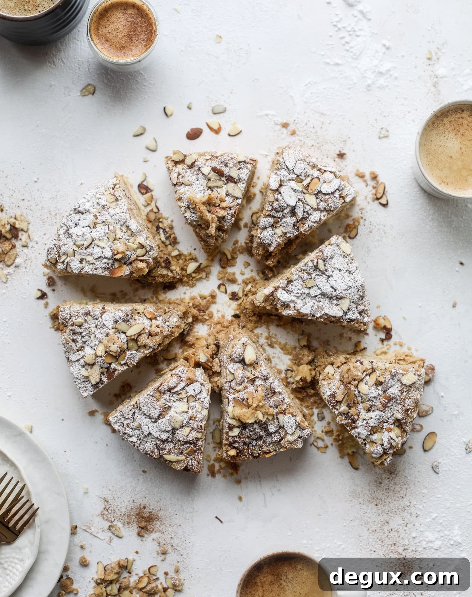 This almond crumb cake is so delicious and perfect for breakfast or dessert! It's full of delicious almond flavor and crunch and the crumb on top is so thick and perfect. It's like an almond croissant on steroids. I howsweeteats.com #almond #crumb #cake