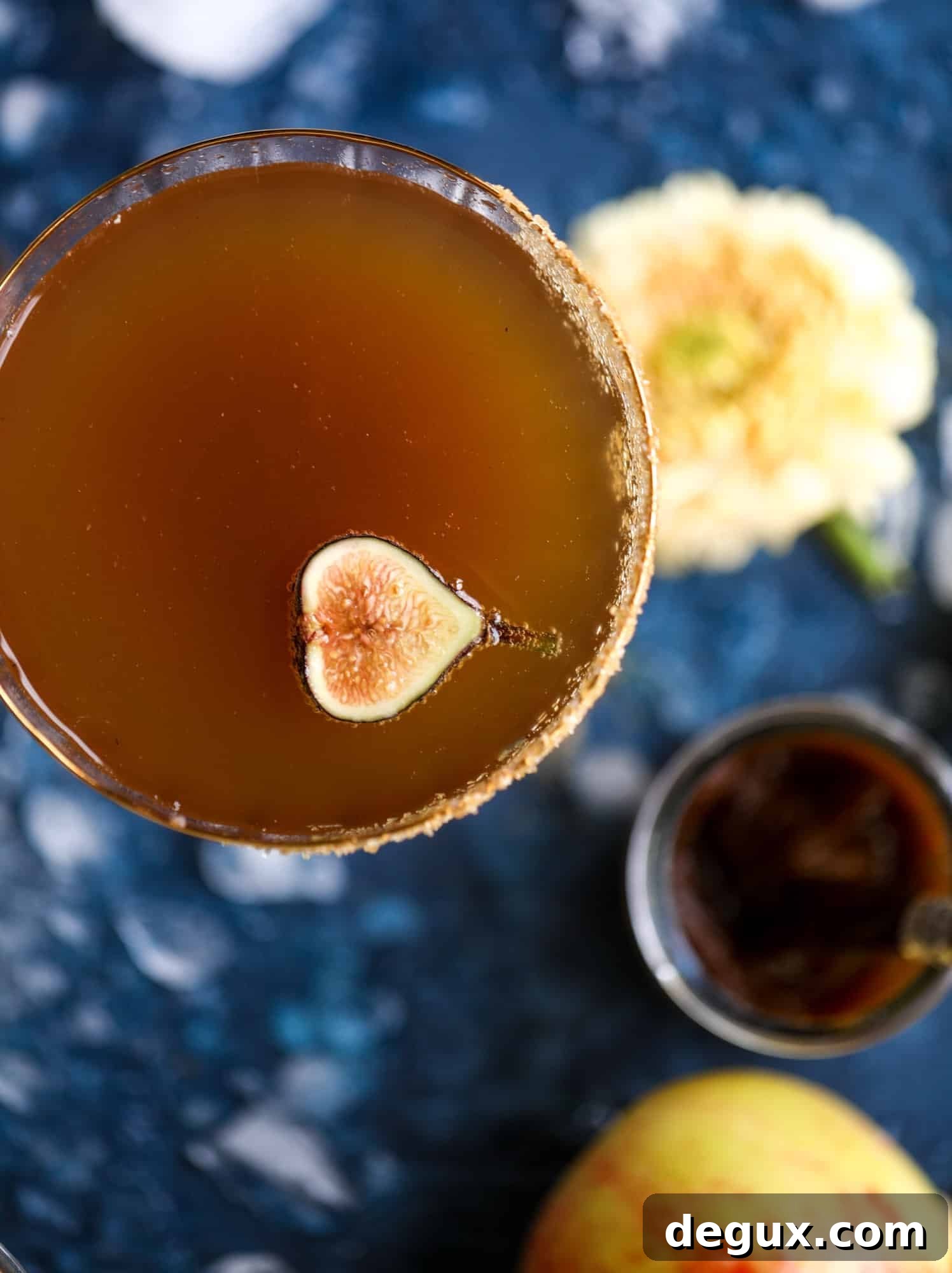 Autumn Apple Bourbon Fizz Cocktail Recipe 10 This apple butter cocktail is perfect for the fall season and incredibly delicious! It's super simple too: you need apple butter, bourbon and ginger ale or ginger beer. A cinnamon sugar rim and a fig garnish make it super pretty. YUM.