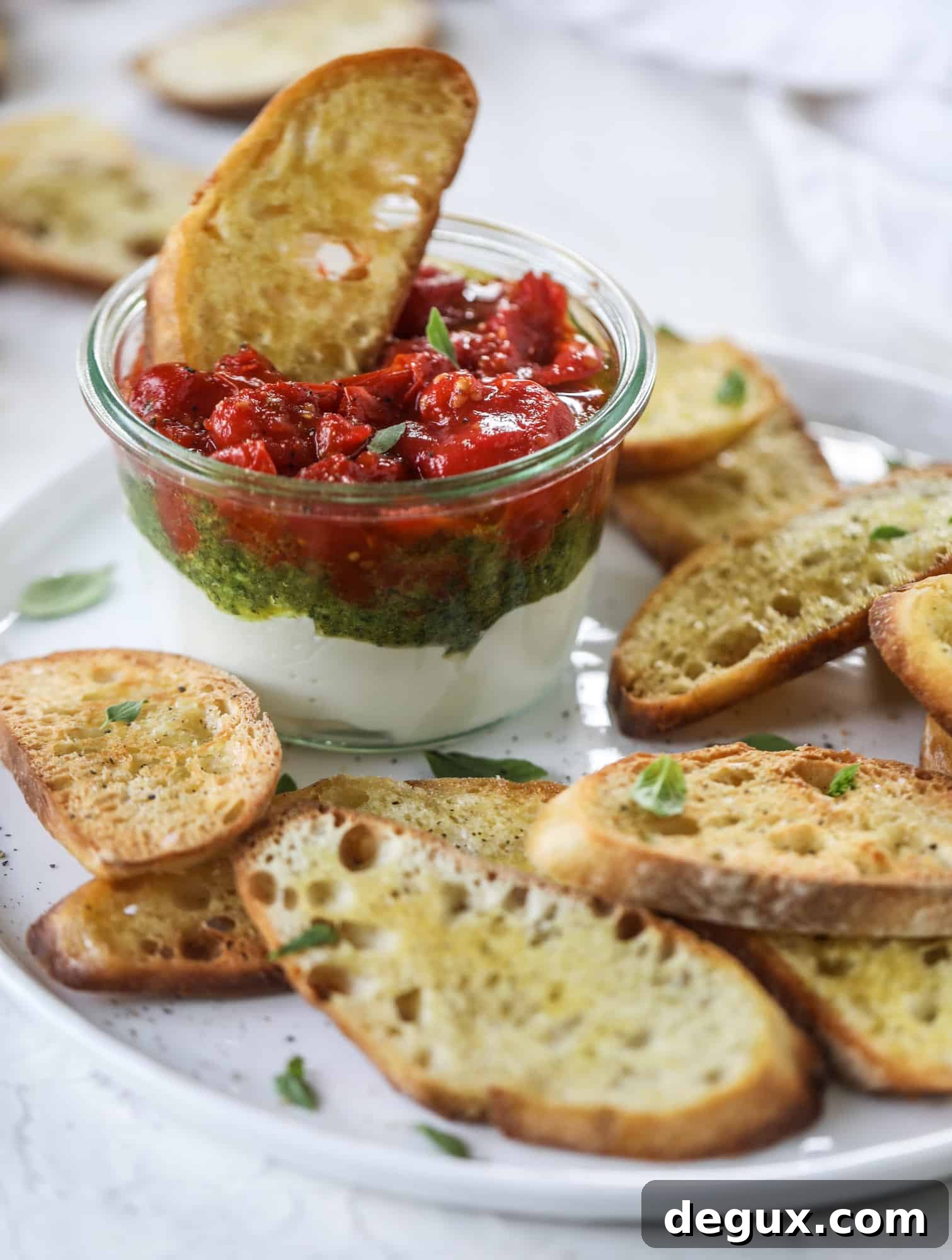 Tomato jam spooned on ricotta