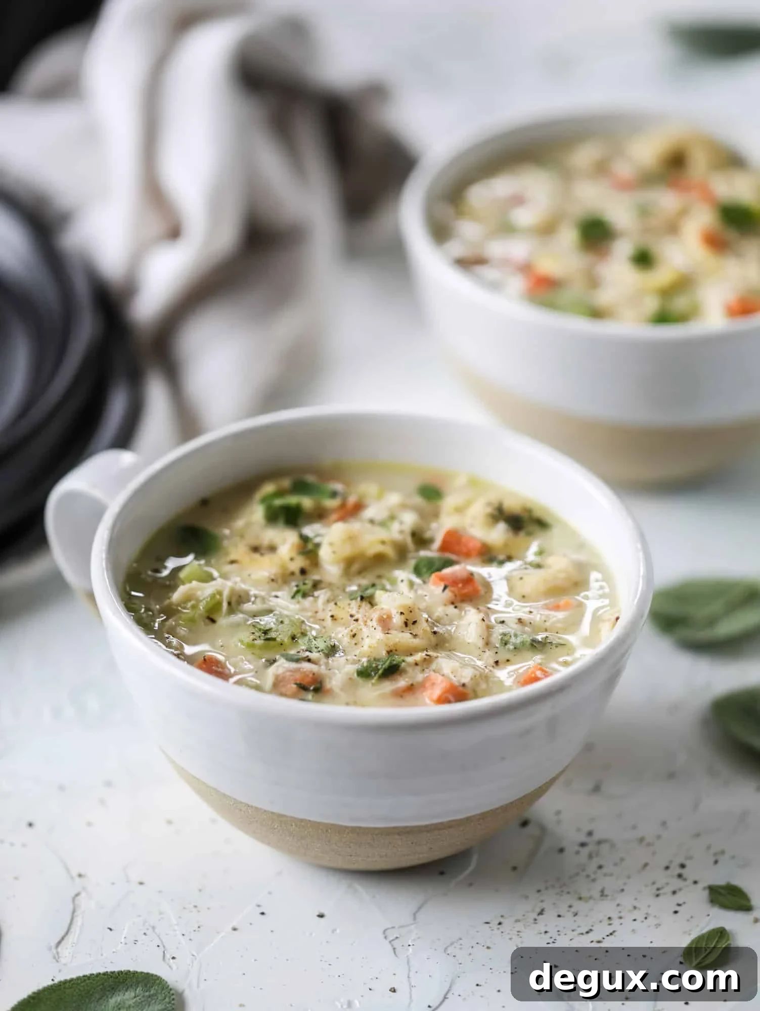 This creamy chicken tortellini soup is the perfect weeknight meal! It comes together quickly and is a great meal to use up a rotisserie chicken. It's satisfying and hearty, with tortellini replacing egg noodles for the pasta. Comfort food perfection! I howsweeteats.com #chicken #soup