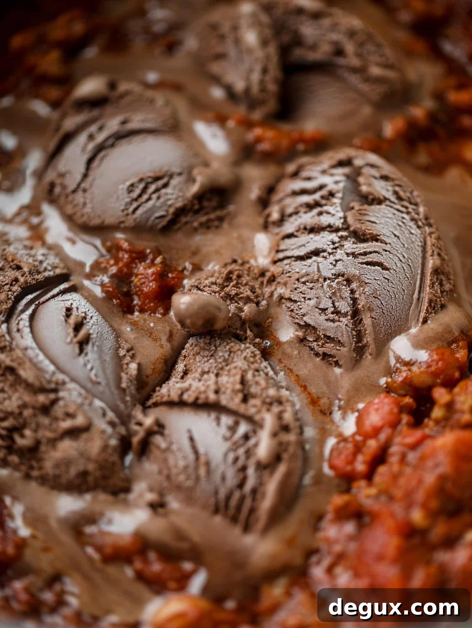 Fire and Ice Chili Recipe: Spicy-Sweet Chili with Cooling Yogurt 4 This fire and ice chili has a secret ingredient that makes it rich, velvety and insanely delicious. Dark chocolate ice cream is stirred in before serving and adds a crazy depth of flavor while bringing so much richness to your favorite bowl. You have to try it! I howsweeteats.com #chili #recipe #ice #cream #chili #bar