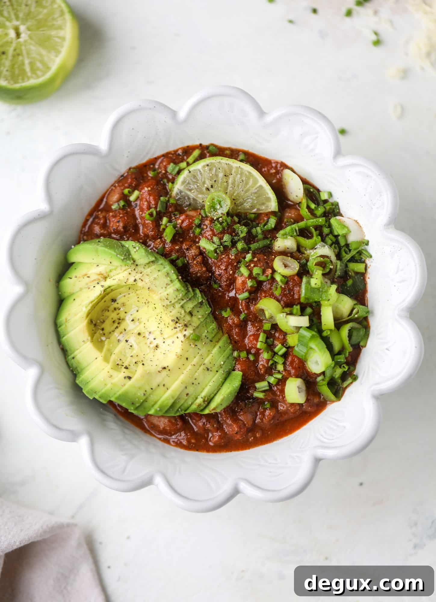 Fire and Ice Chili Recipe: Spicy-Sweet Chili with Cooling Yogurt 5 This fire and ice chili has a secret ingredient that makes it rich, velvety and insanely delicious. Dark chocolate ice cream is stirred in before serving and adds a crazy depth of flavor while bringing so much richness to your favorite bowl. You have to try it! I howsweeteats.com #chili #recipe #ice #cream #chili #bar