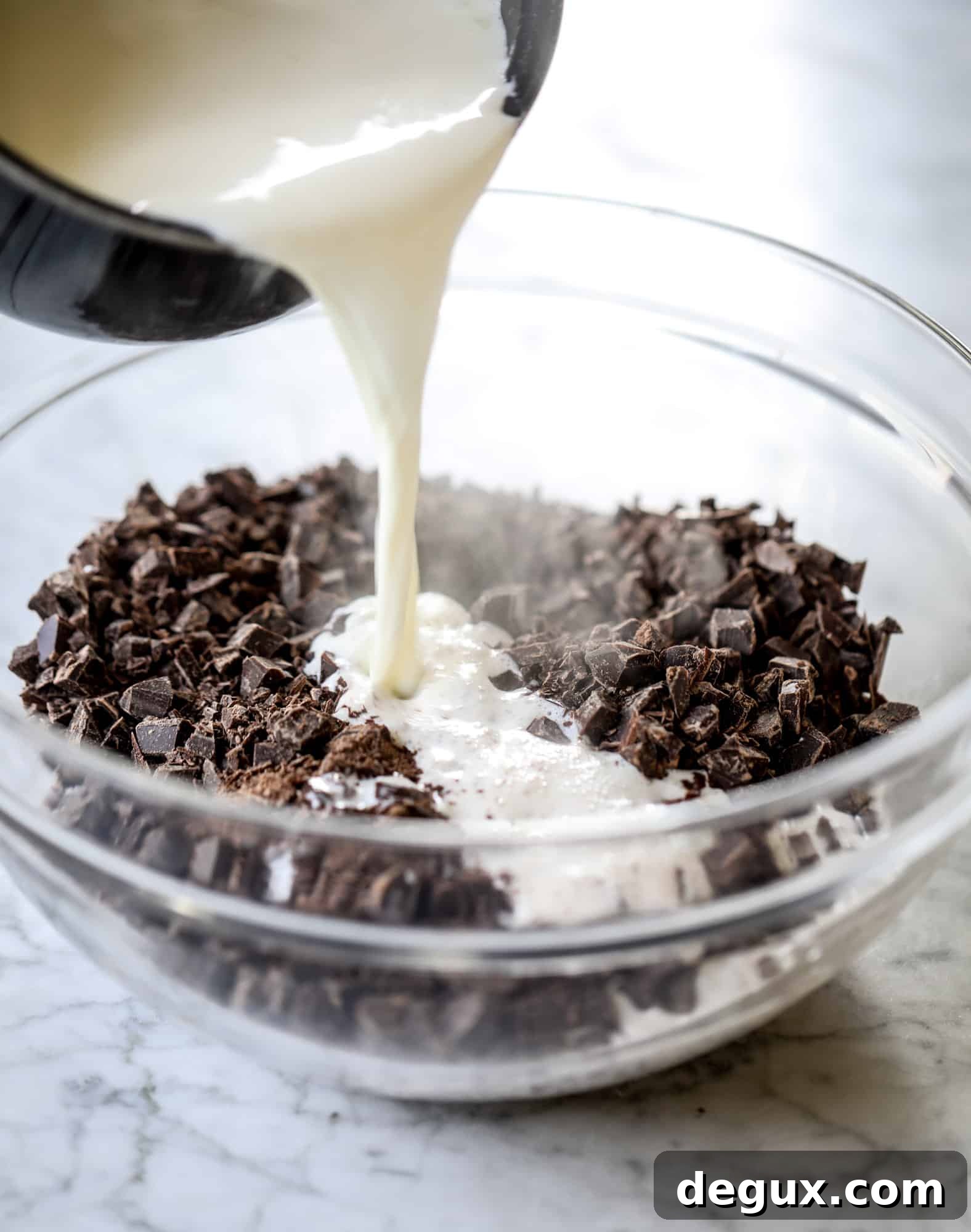 This salted dark chocolate stout cake is absolutely divine! It's ridiculously rich and perfect for a crowd or a party. Pumpkin stout batter is baked into fluffy laters and covered in a super fudgy chocolate ganache. Perfect for chocolate lovers! I howsweeteats.com #dark #chocolate #stout #cake #salted
