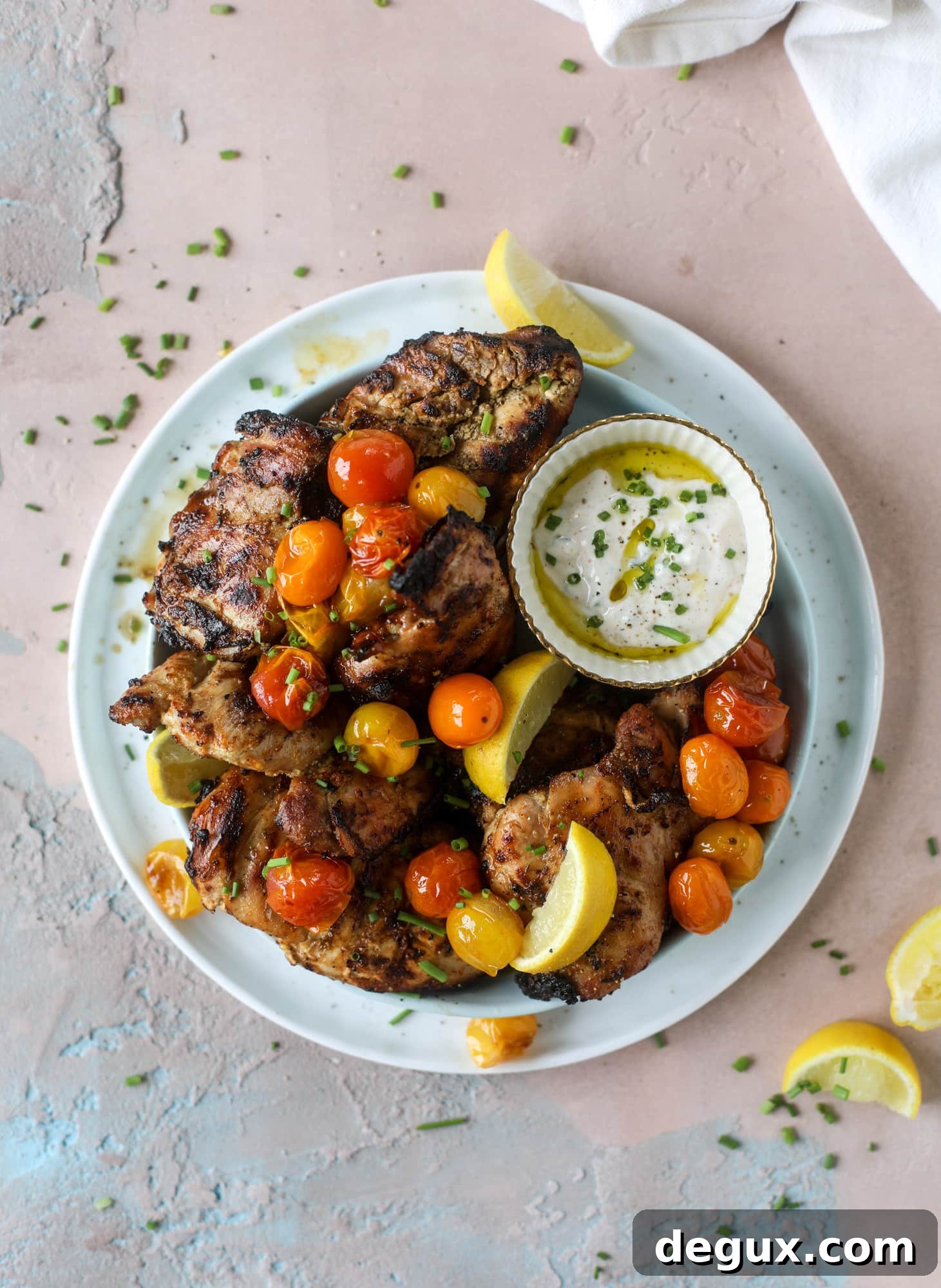 Lemon Yogurt Marinated Grilled Chicken Recipe 4 This yogurt marinated chicken recipe is super flavorful, tender, juicy and delicious. The fresh lemon adds a kick of flavor and it's a versatile recipe you can make for lunch or dinner. Grill it and serve with your favorite side, then use the leftovers for lunch! I howsweeteats.com #yogurt #chicken #lemon #grilled #healthy #recipes