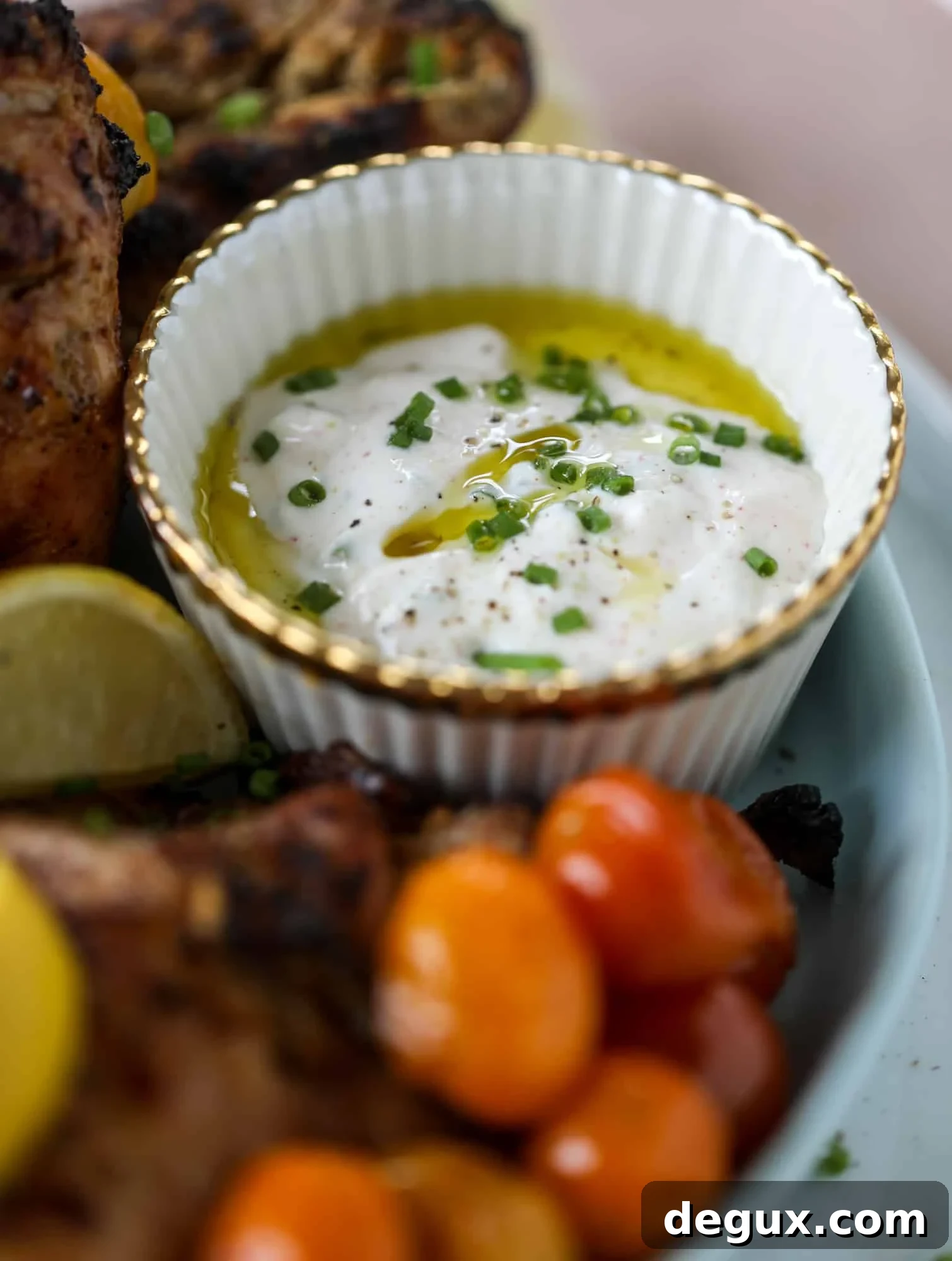 Lemon Yogurt Marinated Grilled Chicken Recipe 5 This yogurt marinated chicken recipe is super flavorful, tender, juicy and delicious. The fresh lemon adds a kick of flavor and it's a versatile recipe you can make for lunch or dinner. Grill it and serve with your favorite side, then use the leftovers for lunch! I howsweeteats.com #yogurt #chicken #lemon #grilled #healthy #recipes
