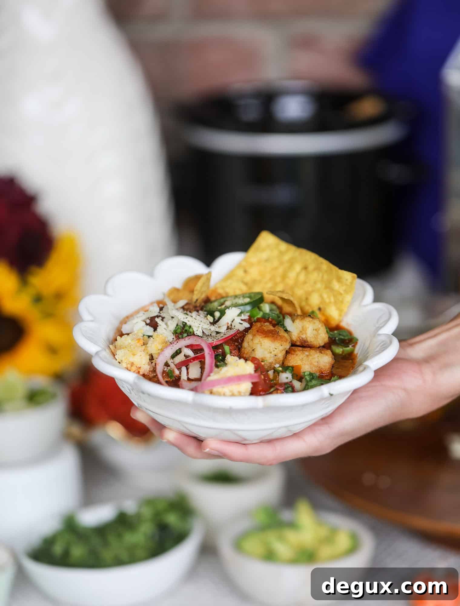 This is the best way to set up a chili bar! All my tips and tricks for setting up a perfect chili bar with multiple toppings, a nacho bar, hot dogs - all done with prep to make the day of the party super easy! This chili bar is goals. I howsweeteats.com #chili #bar #how #to