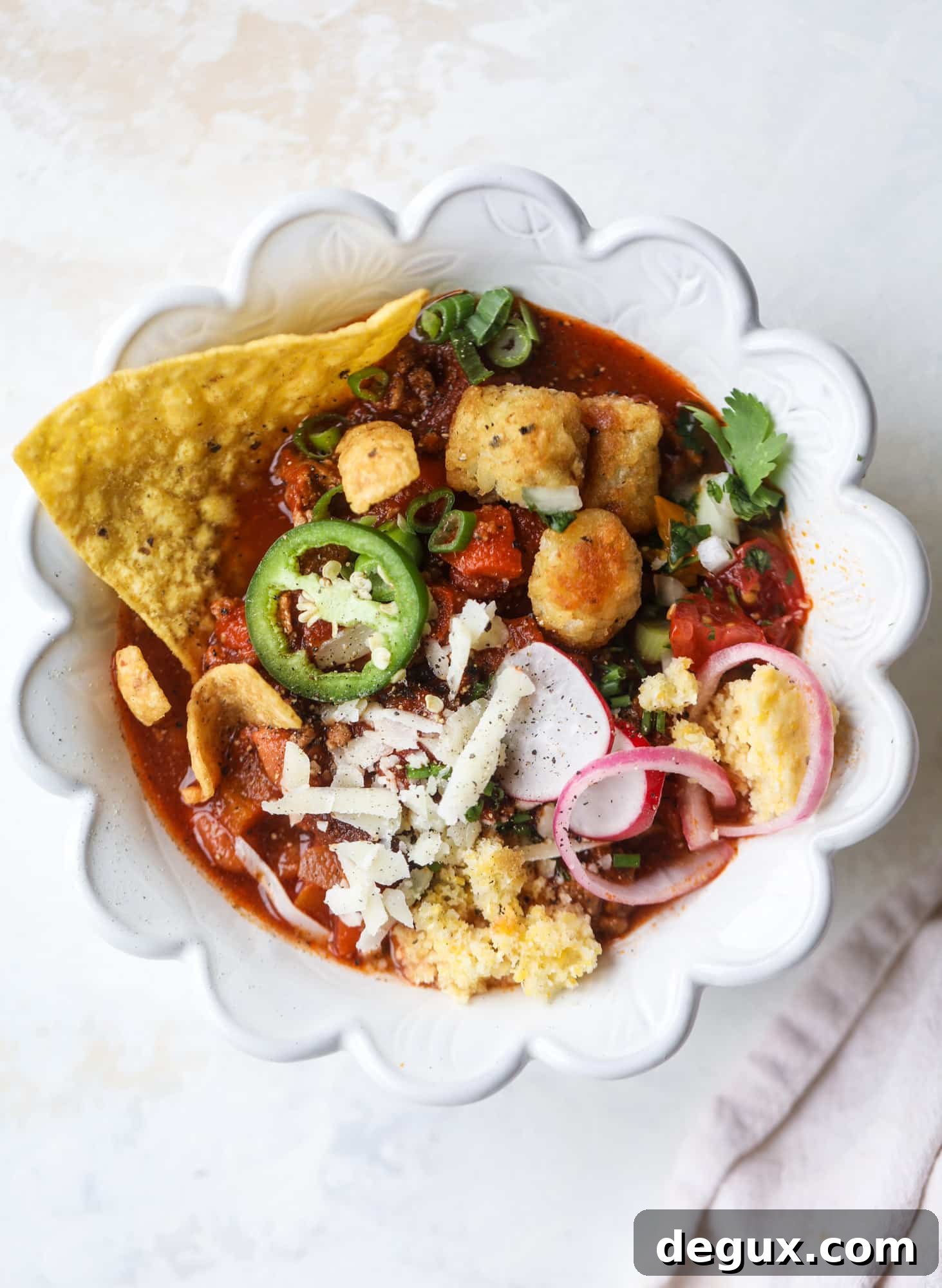 This is the best way to set up a chili bar! All my tips and tricks for setting up a perfect chili bar with multiple toppings, a nacho bar, hot dogs - all done with prep to make the day of the party super easy! This chili bar is goals. I howsweeteats.com #chili #bar #how #to