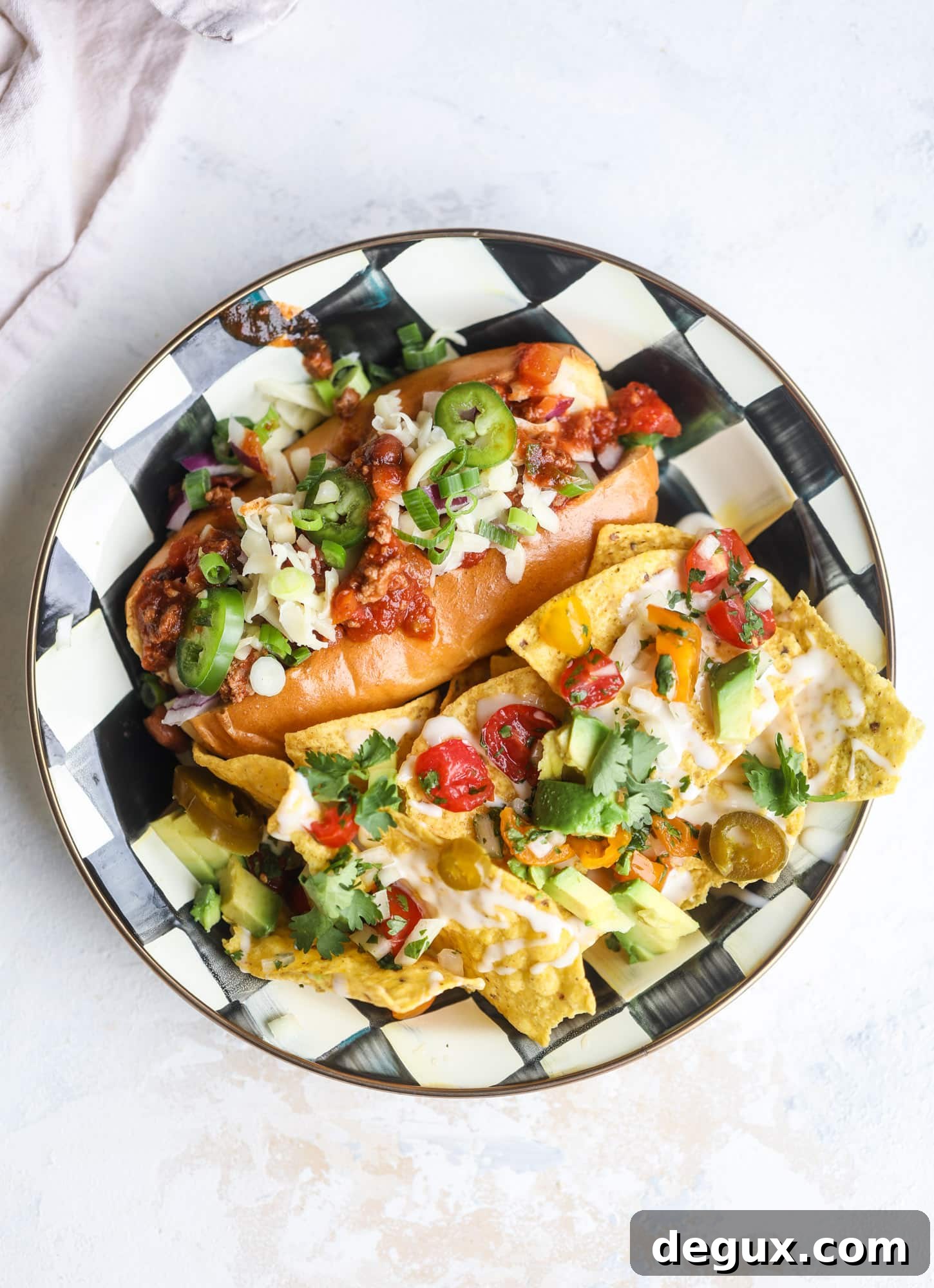 This is the best way to set up a chili bar! All my tips and tricks for setting up a perfect chili bar with multiple toppings, a nacho bar, hot dogs - all done with prep to make the day of the party super easy! This chili bar is goals. I howsweeteats.com #chili #bar #how #to