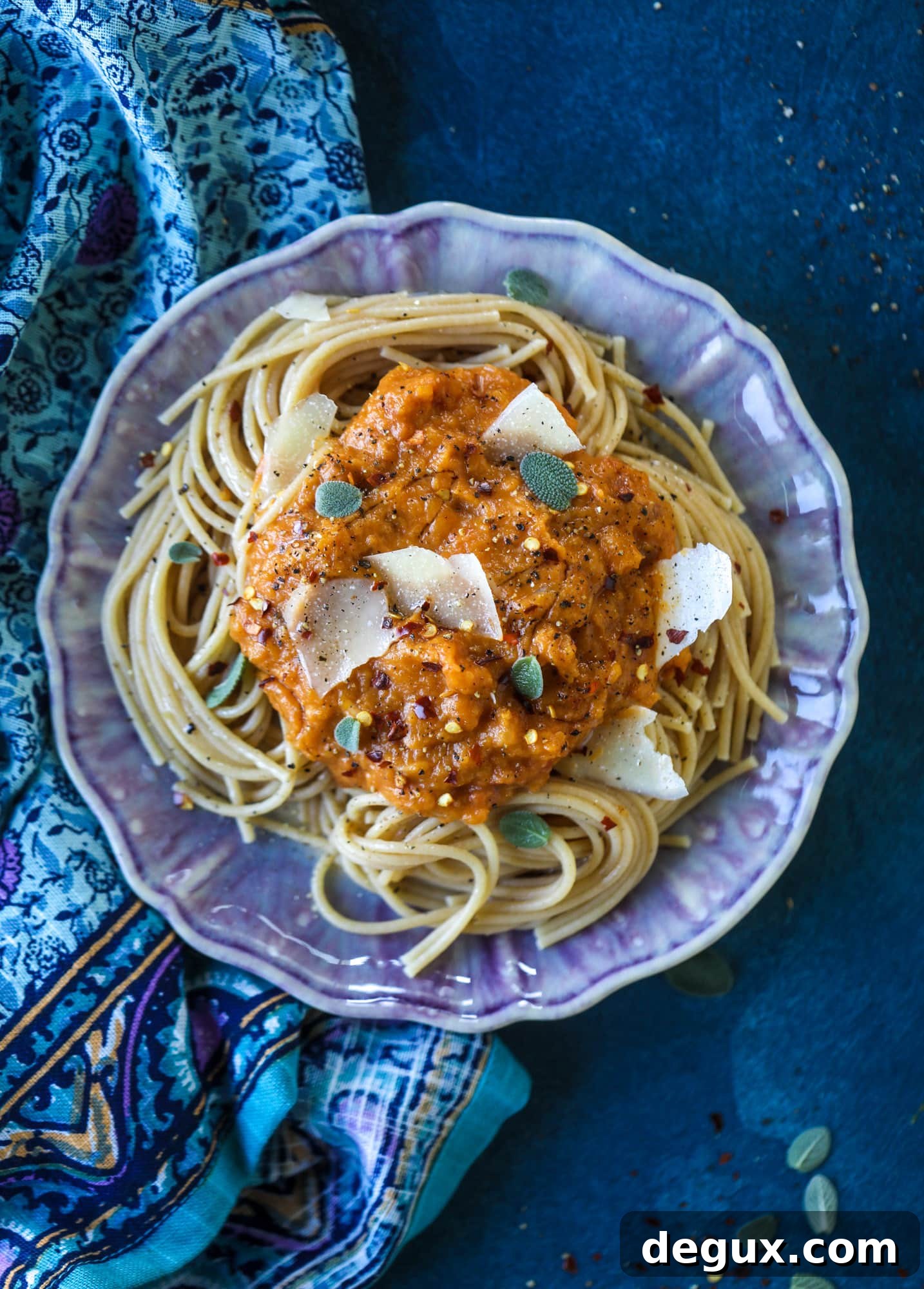 This butternut squash pasta sauce is heaven for an October dinner! Fire roasted tomatoes, butternut squash, pumpkin, sage, spice and parmesan all come together to create a delicious, simmered pot of sauce to blanket your favorite pasta!
