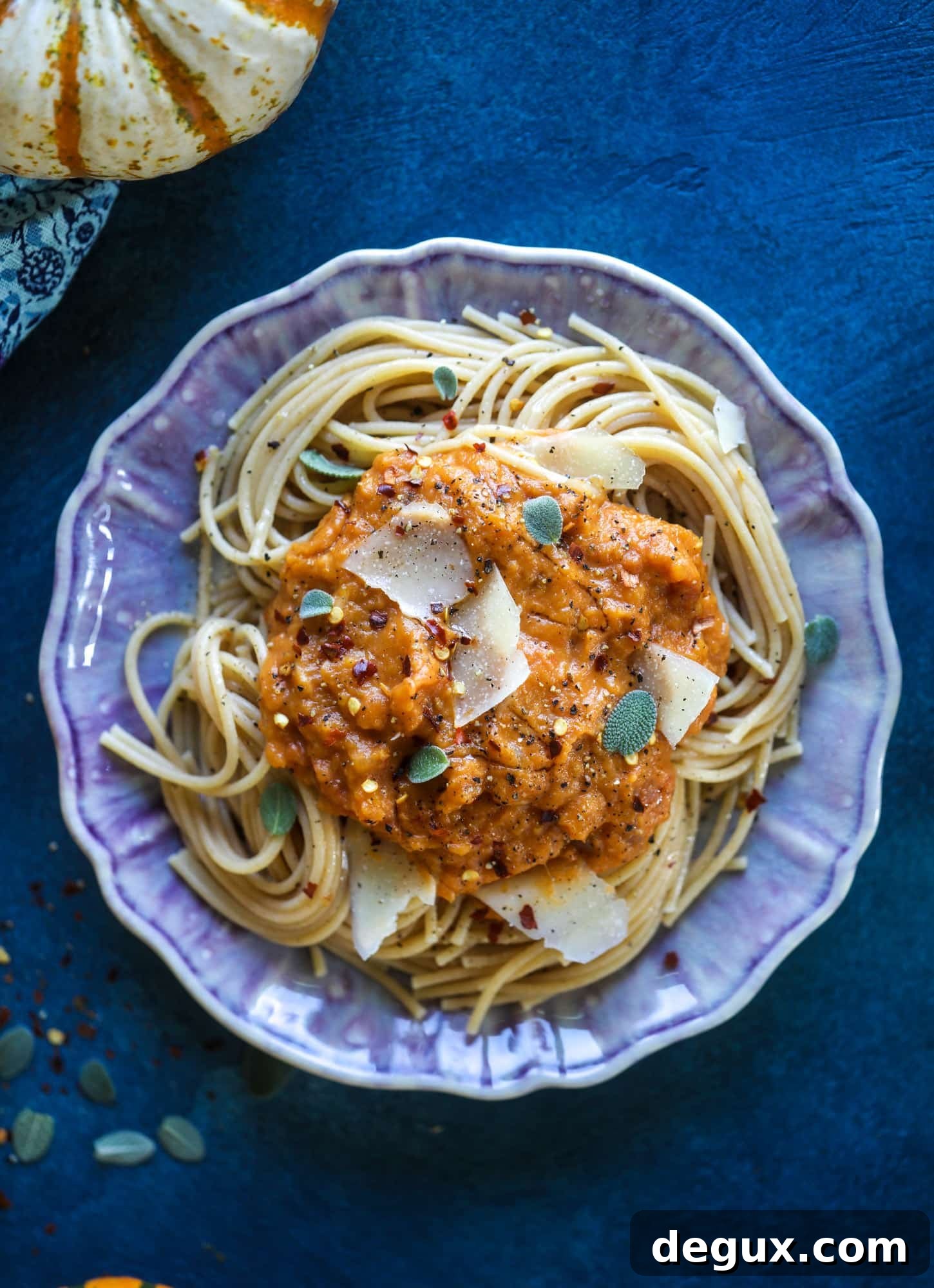 This butternut squash pasta sauce is heaven for an October dinner! Fire roasted tomatoes, butternut squash, pumpkin, sage, spice and parmesan all come together to create a delicious, simmered pot of sauce to blanket your favorite pasta!