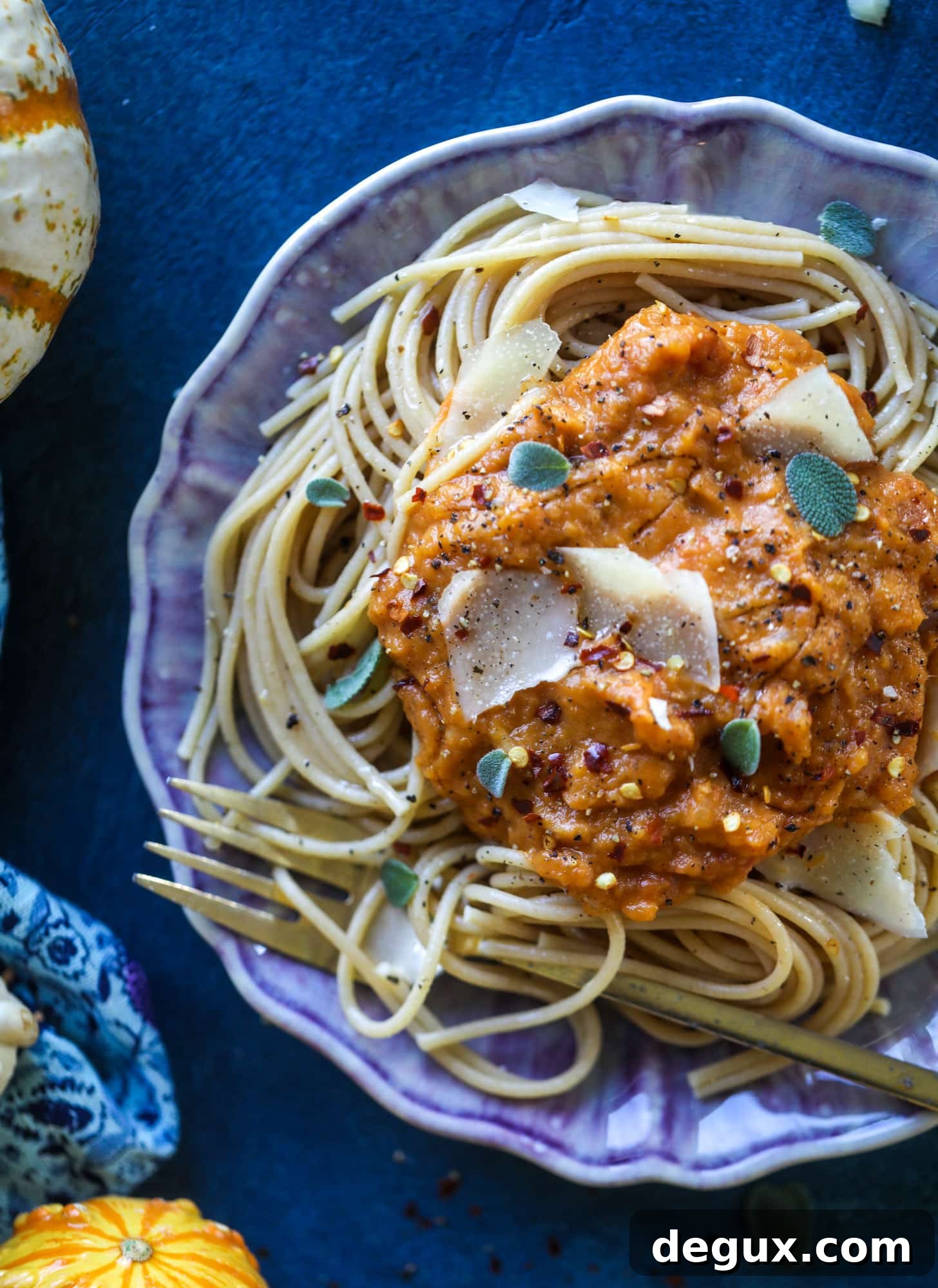 This butternut squash pasta sauce is heaven for an October dinner! Fire roasted tomatoes, butternut squash, pumpkin, sage, spice and parmesan all come together to create a delicious, simmered pot of sauce to blanket your favorite pasta!