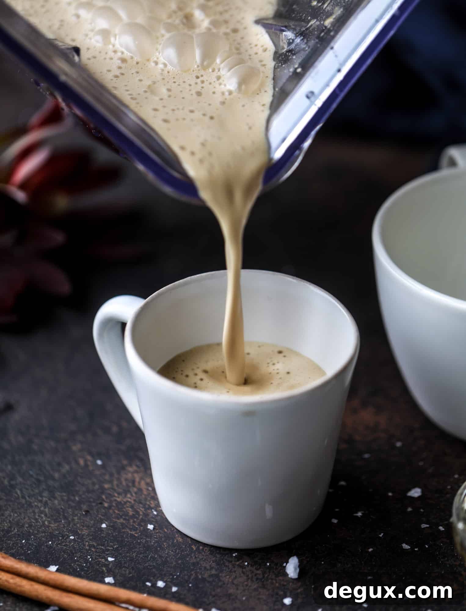This salted maple power coffee is the perfect creamy pick-me up. Maple syrup, coconut butter and sea salt are blended with hot coffee to make the most deliciously whipped hot, frothy latte-like drink, without any dairy! I howsweeteats.com #coffee #coconutbutter