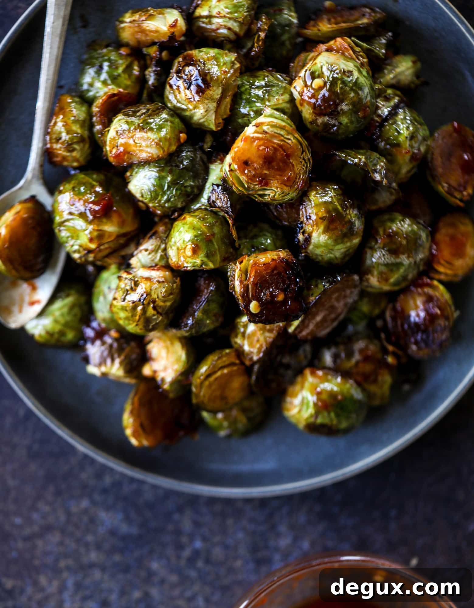 These sweet and spicy Brussels sprouts are roasted to perfection and make a delicious side dish.