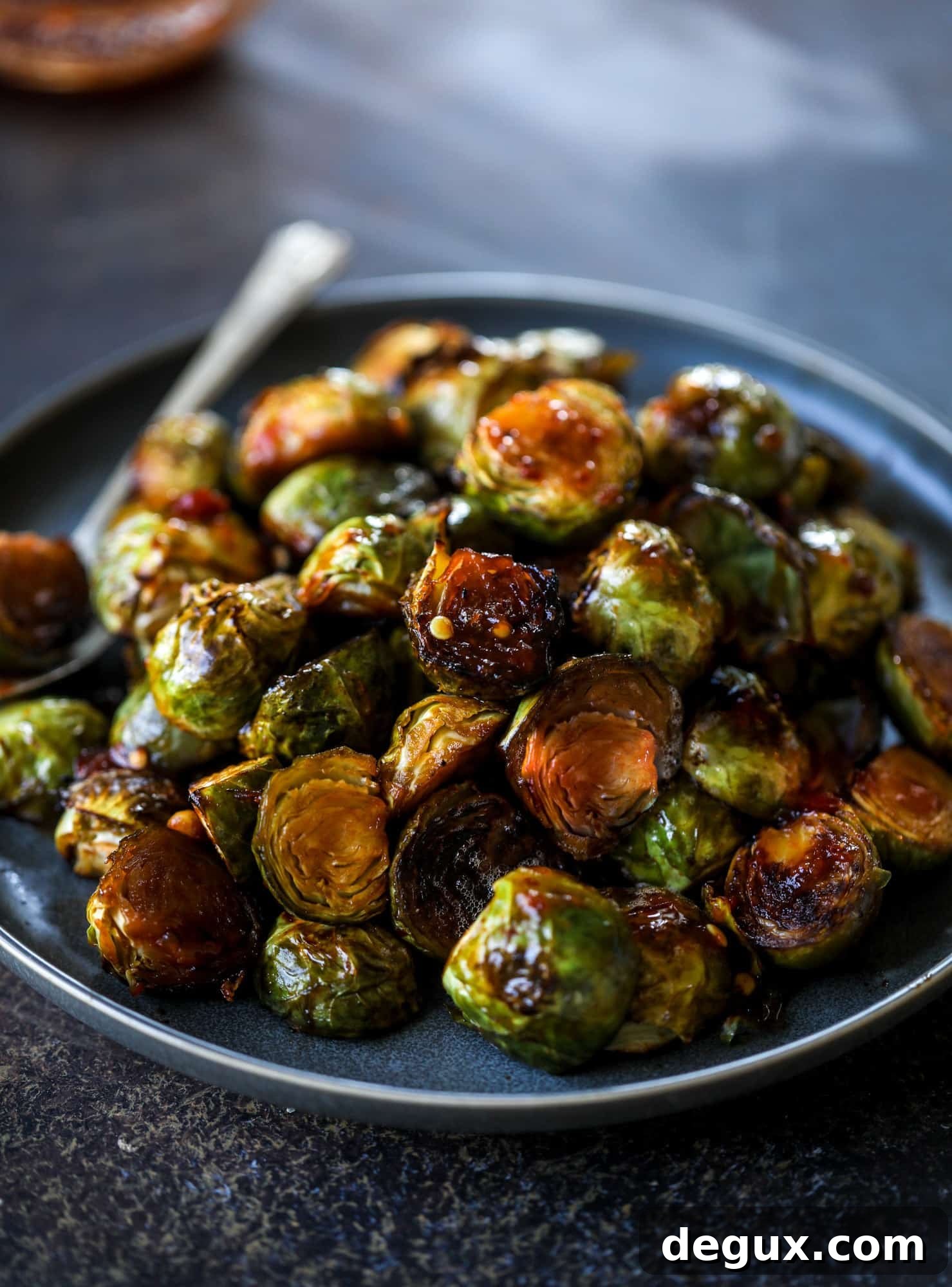 These sweet and spicy Brussels sprouts are roasted to perfection and make a delicious side dish.