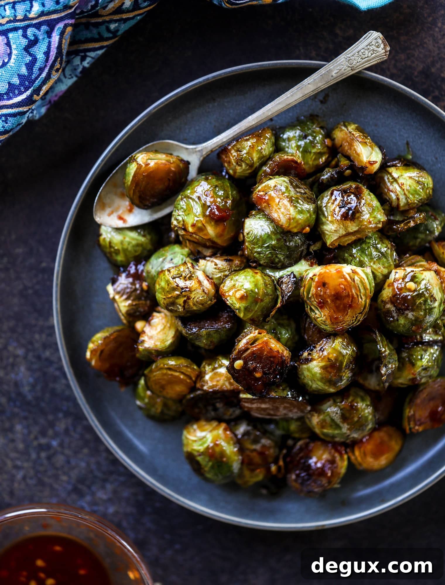 These sweet and spicy Brussels sprouts are roasted to perfection and make a delicious side dish.