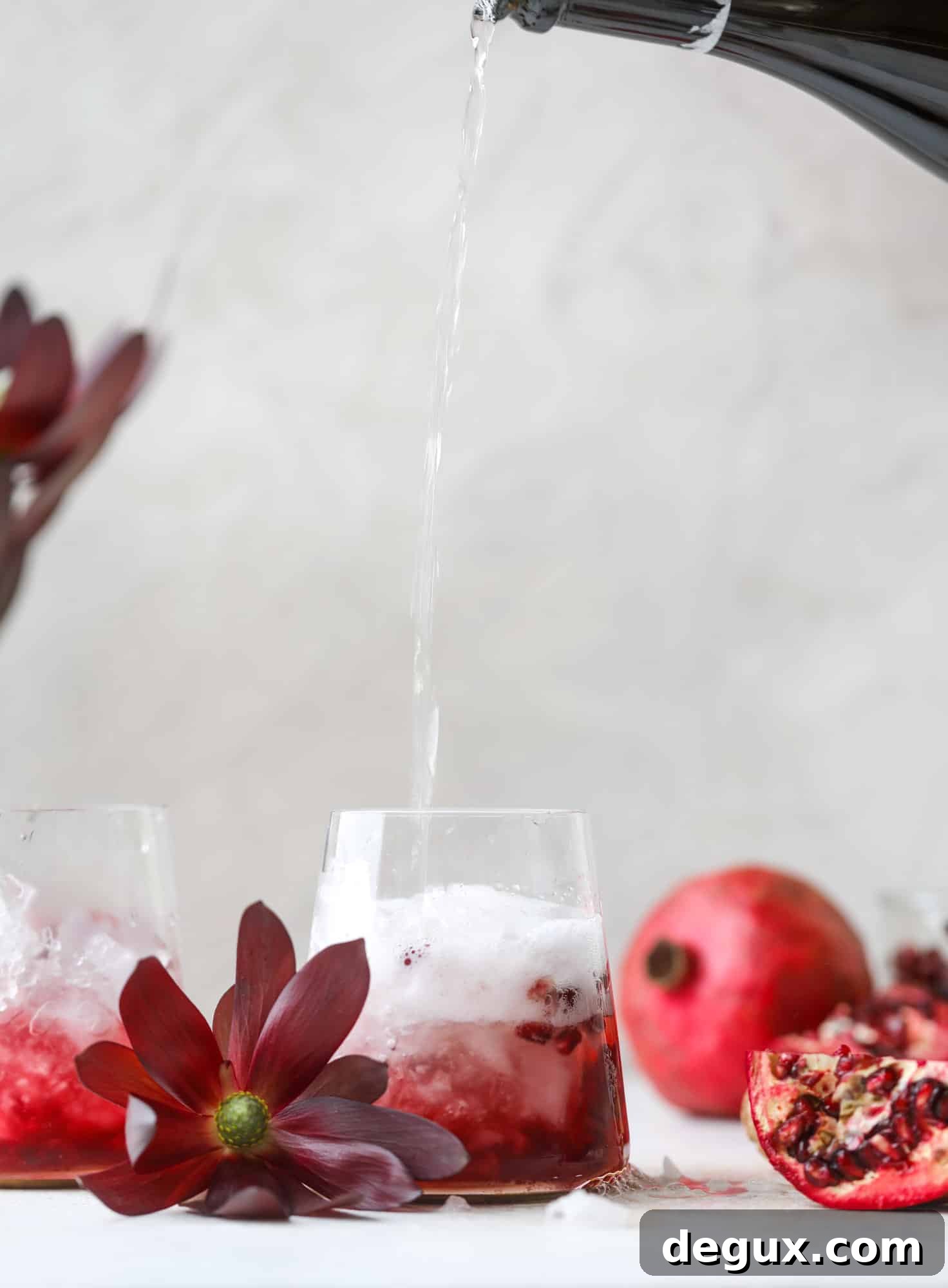 Pomegranate Prosecco Smash: 8 Thanksgiving Cocktails to Try 4 Close up of pomegranate prosecco smash