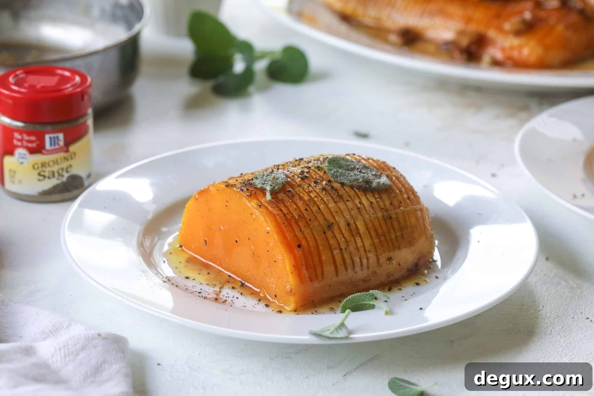 Baked hasselback butternut squash with beautifully caramelized edges.