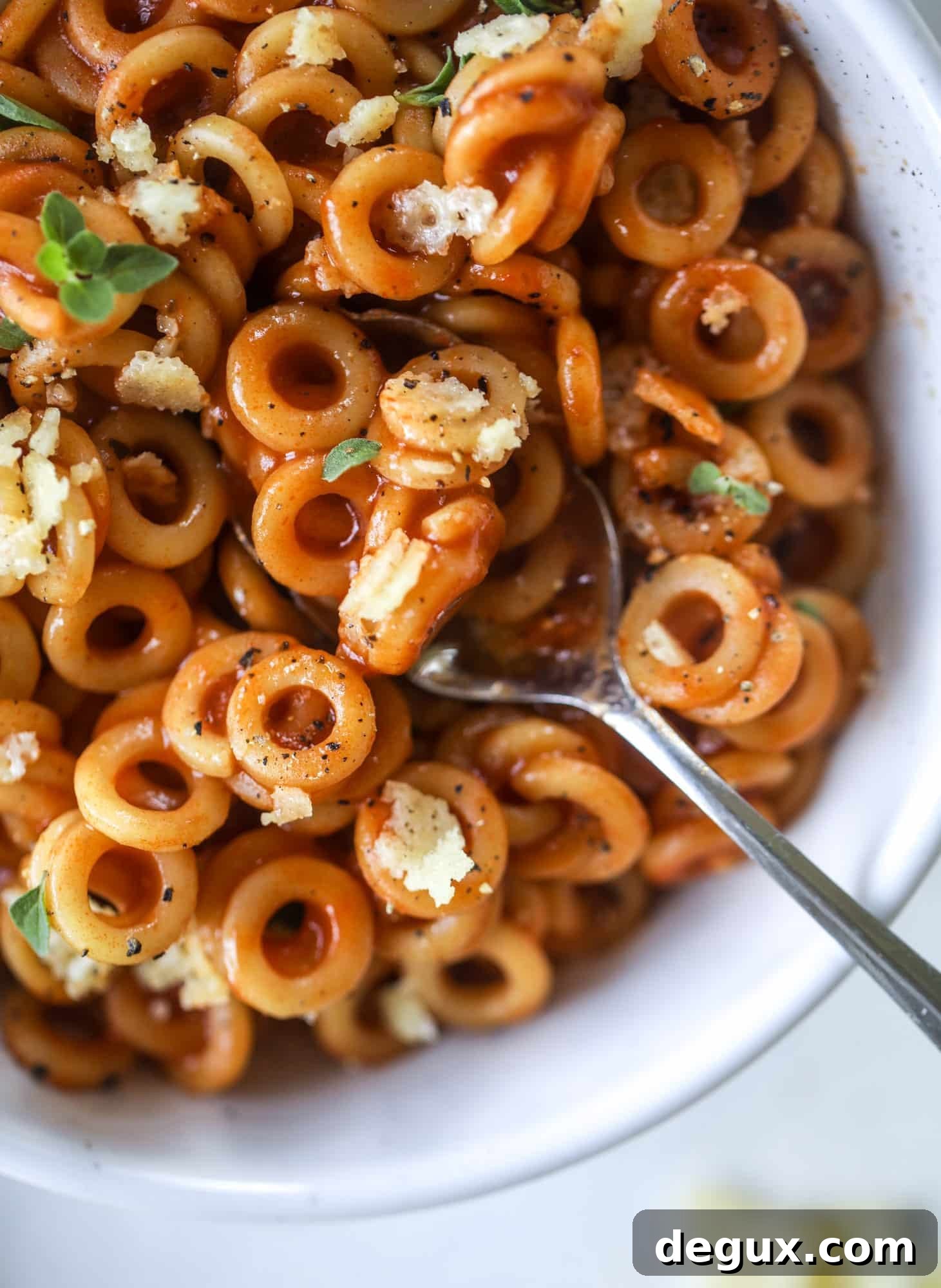 These homemade spaghettios are the ultimate comfort food! They come together in less than 30 minutes, are super easy and flavorful and topped with crispy crunchy manchego cheese that takes the taste over the top!