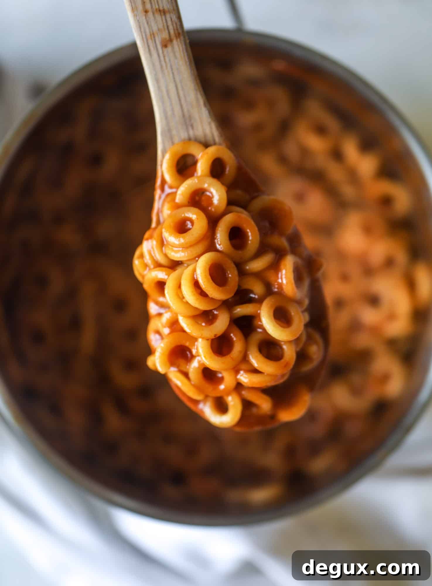 These homemade spaghettios are the ultimate comfort food! They come together in less than 30 minutes, are super easy and flavorful and topped with crispy crunchy manchego cheese that takes the taste over the top!