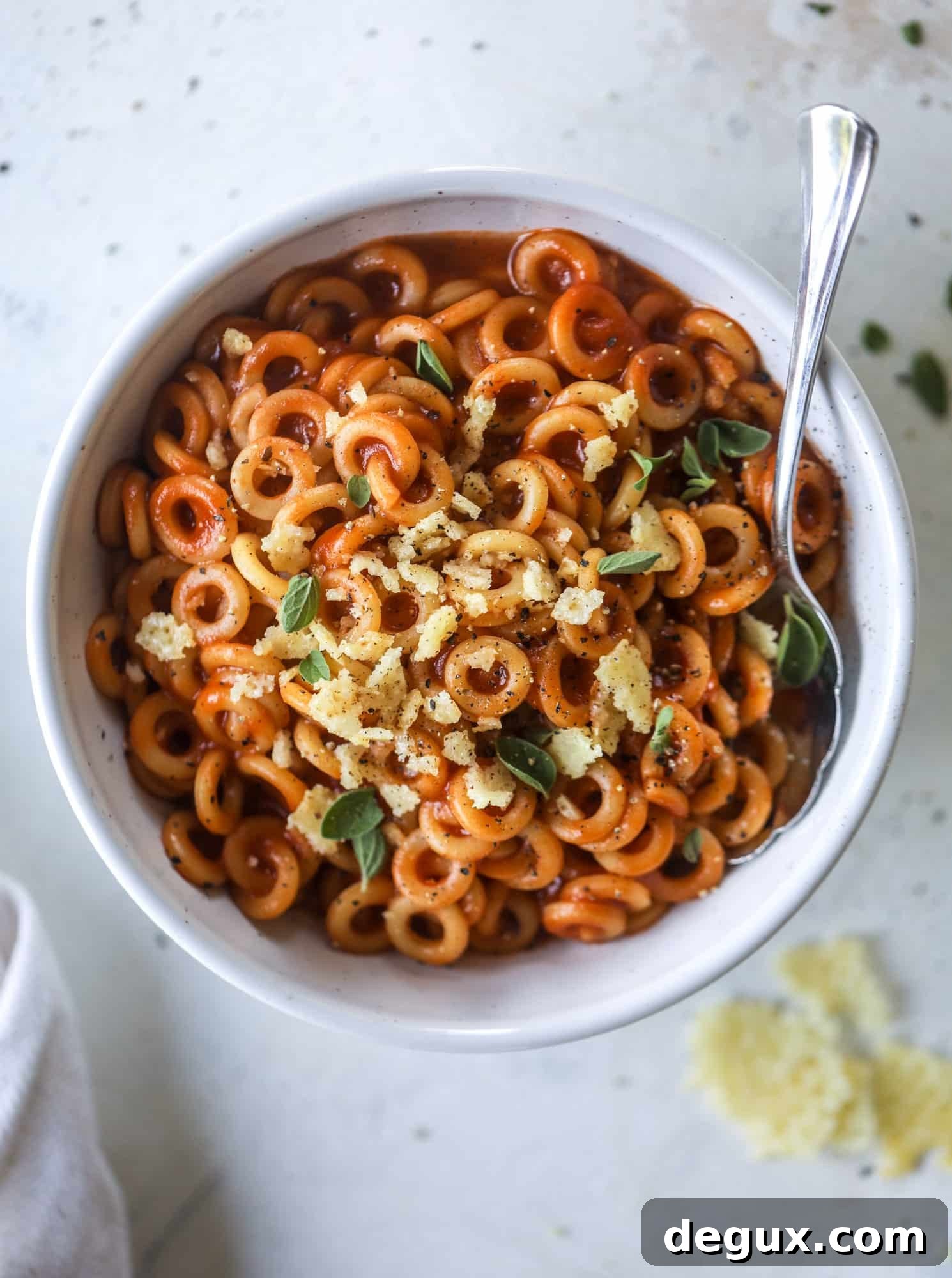 These homemade spaghettios are the ultimate comfort food! They come together in less than 30 minutes, are super easy and flavorful and topped with crispy crunchy manchego cheese that takes the taste over the top!