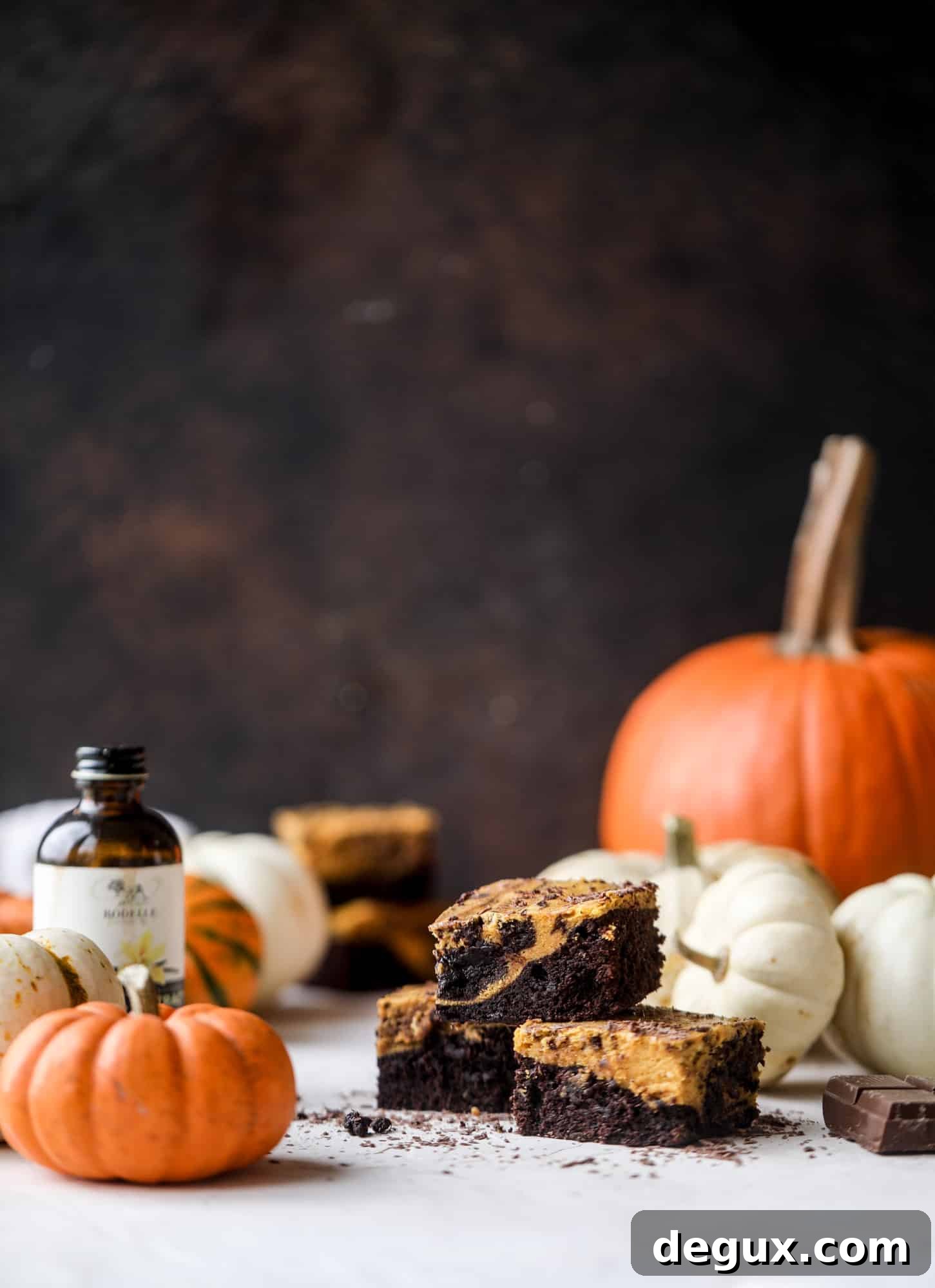 These pumpkin brownies have a fudgy layer of chocolate on the bottom and a silky layer of pumpkin on top! They are so delicious and rich and perfect for fall. The pumpkin brownies come together easily and can be made ahead of time too!