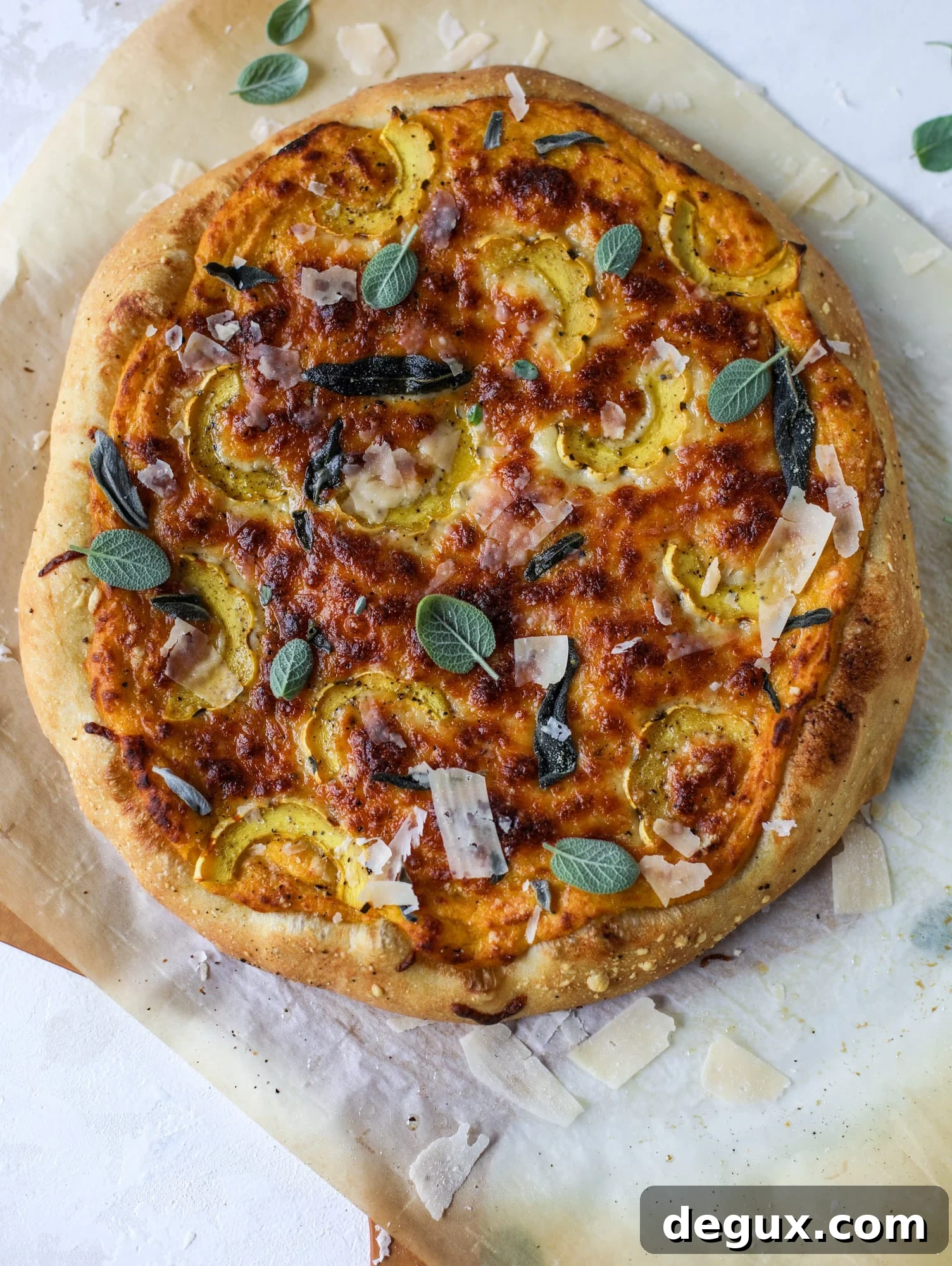 This butternut squash pizza has all the perfect tastes of fall in a pizza! Creamy butternut squash base, sharp parmesan cheese, crispy, fresh sage - it's all these and so super flavorful. It's easy too! I howsweeteats.com #butternutsquash #pizza