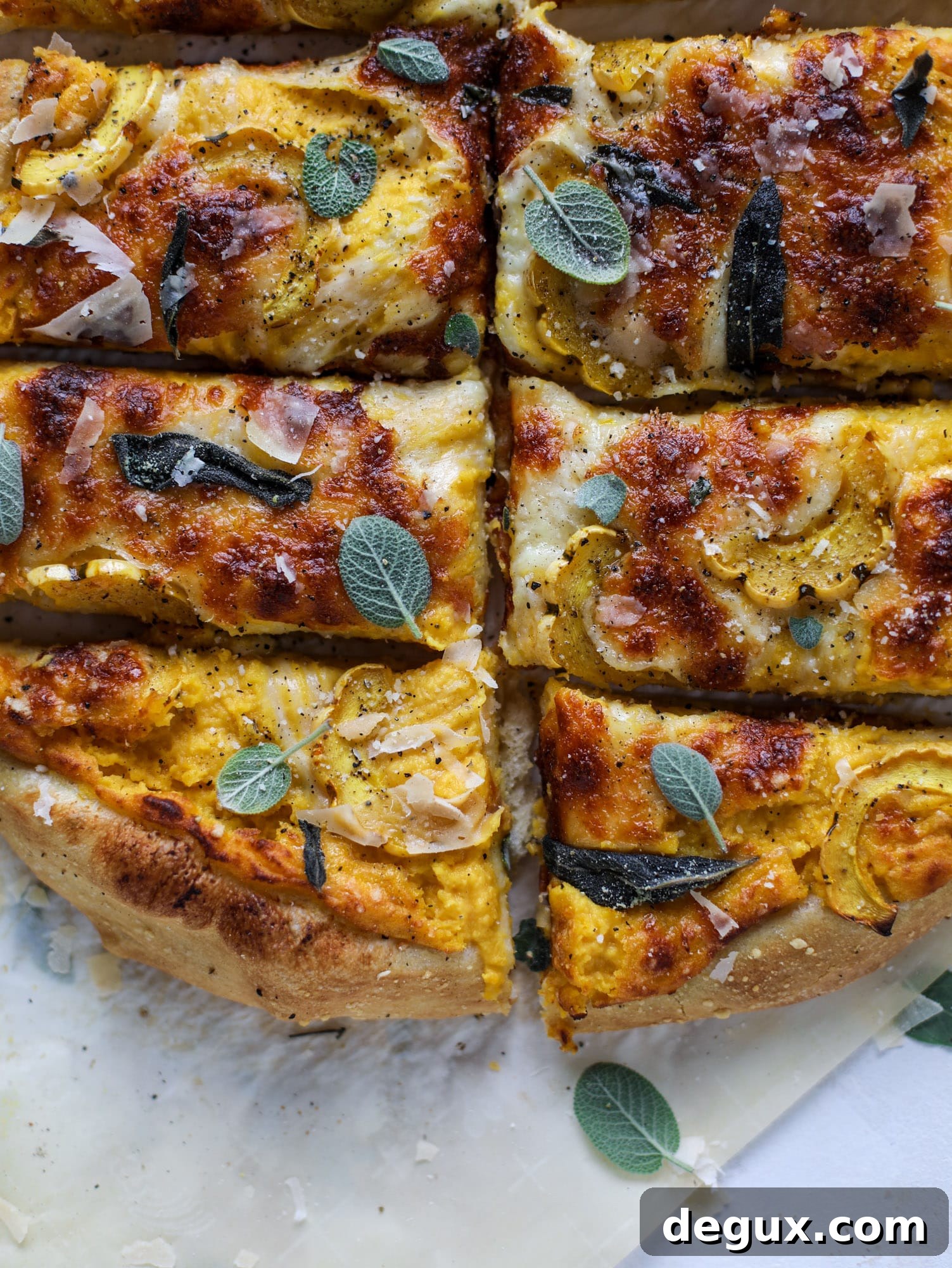 This butternut squash pizza has all the perfect tastes of fall in a pizza! Creamy butternut squash base, sharp parmesan cheese, crispy, fresh sage - it's all these and so super flavorful. It's easy too! I howsweeteats.com #butternutsquash #pizza