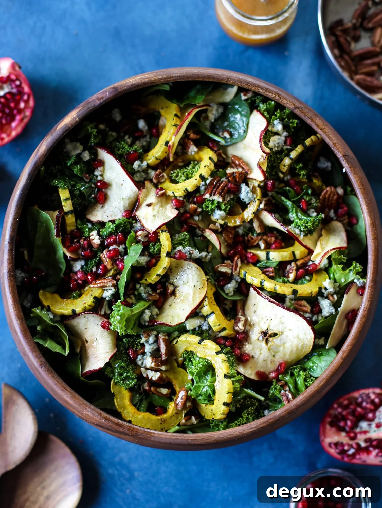 Thanksgiving Kale Salad with Cranberry-Cinnamon Vinaigrette 2 This thanksgiving salad is full of so much autumn flavor. It has toasted pomegranate, delicata squash, toasted pecans, creamy blue cheese and crunchy apple chips. It's light enough to serve before the big meal! I howsweeteats.com #thanksgiving #salad