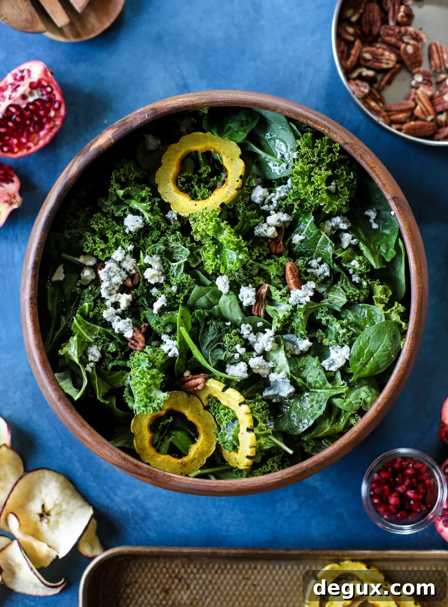 Thanksgiving Kale Salad with Cranberry-Cinnamon Vinaigrette 3 This thanksgiving salad is full of so much autumn flavor. It has toasted pomegranate, delicata squash, toasted pecans, creamy blue cheese and crunchy apple chips. It's light enough to serve before the big meal! I howsweeteats.com #thanksgiving #salad