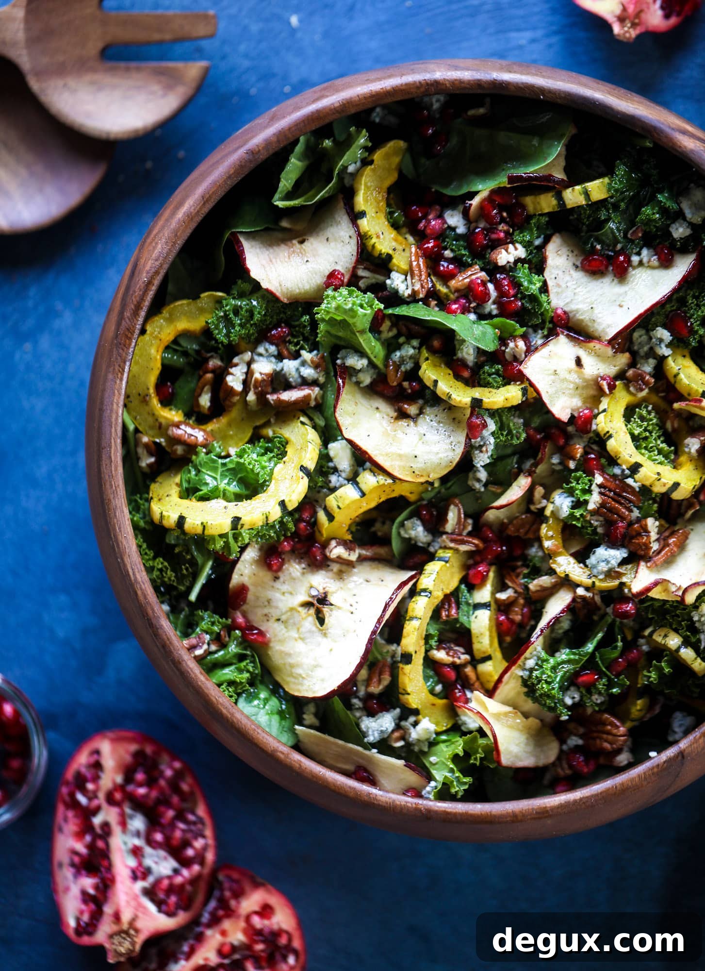 Thanksgiving Kale Salad with Cranberry-Cinnamon Vinaigrette 6 This thanksgiving salad is full of so much autumn flavor. It has toasted pomegranate, delicata squash, toasted pecans, creamy blue cheese and crunchy apple chips. It's light enough to serve before the big meal! I howsweeteats.com #thanksgiving #salad