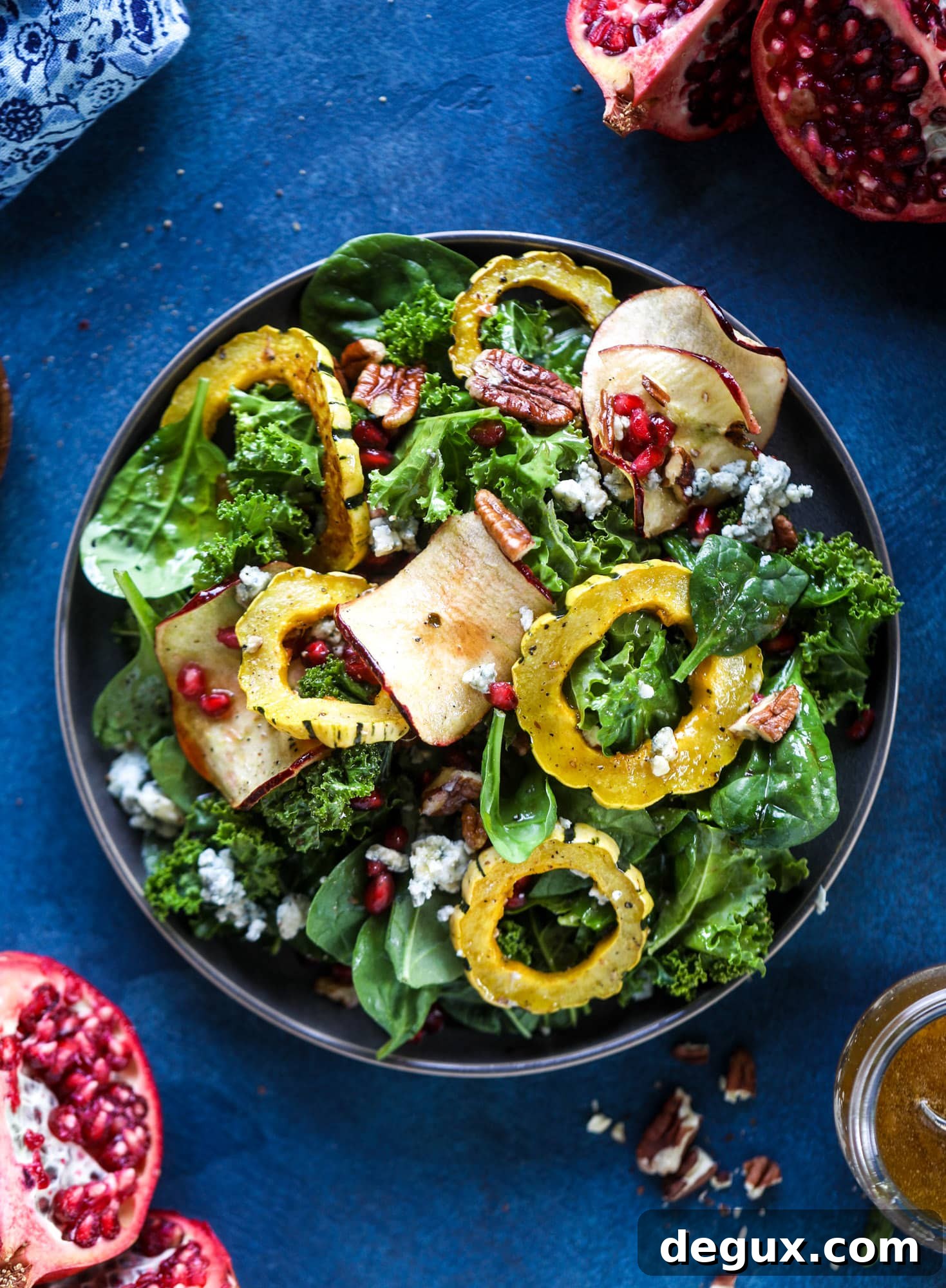 Thanksgiving Kale Salad with Cranberry-Cinnamon Vinaigrette 8 This thanksgiving salad is full of so much autumn flavor. It has toasted pomegranate, delicata squash, toasted pecans, creamy blue cheese and crunchy apple chips. It's light enough to serve before the big meal! I howsweeteats.com #thanksgiving #salad