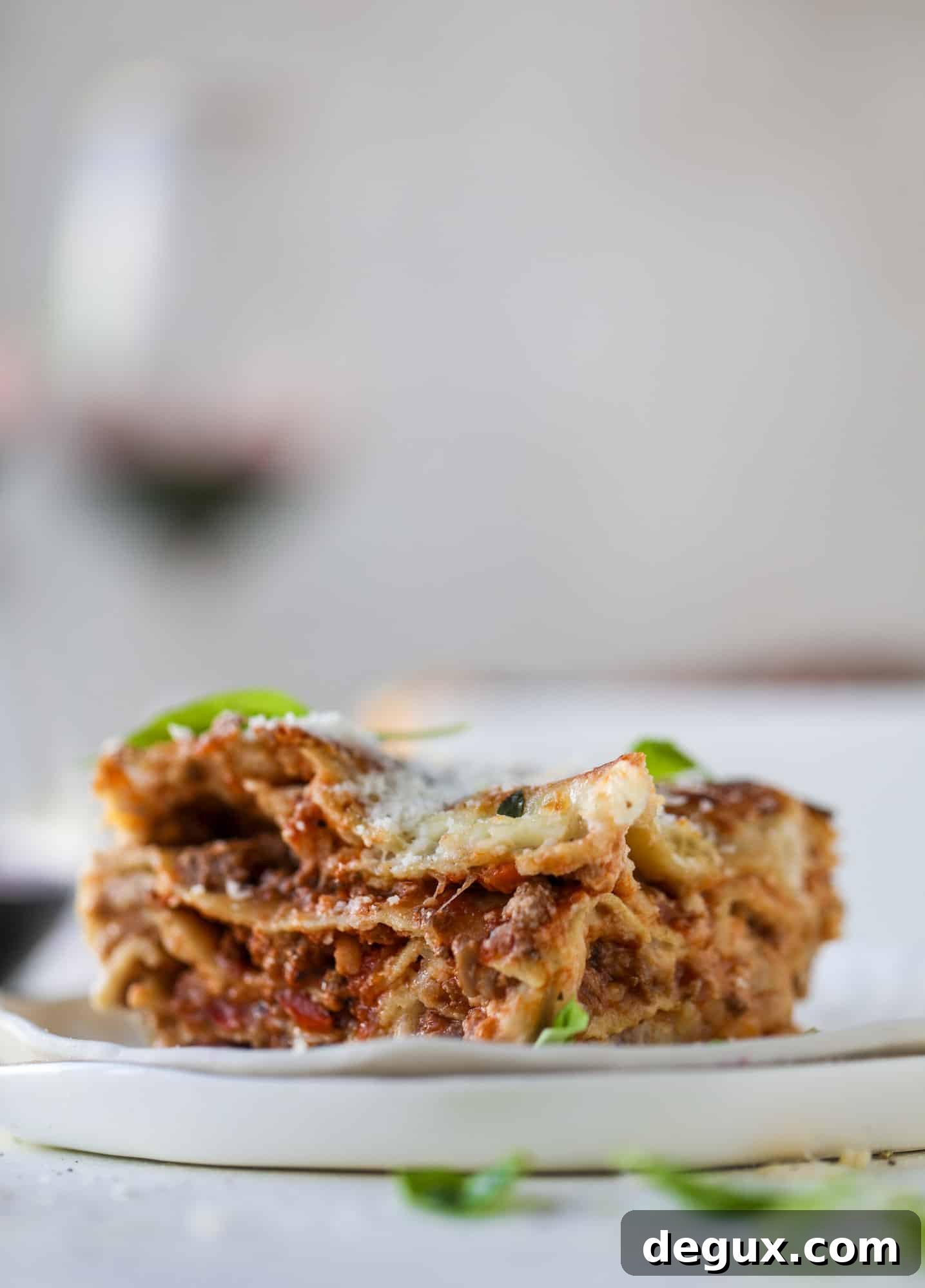This lasagna bolognese is the ultimate comfort food. Meaty sauce, whole wheat lasagna noodles, creamy bechamel and grated cheese come together to create the most perfect slice of lasagna heaven!