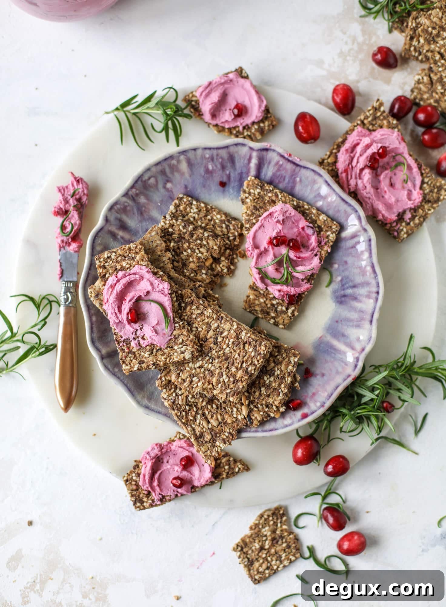 This whipped cranberry goat cheese spread is the perfect holiday appetizer! You can make it ahead of time and serve it with a cheese board or bread and crackers - before or during the meal! Plus it's super pretty too! I howsweeteats.com #cranberry #goatcheese