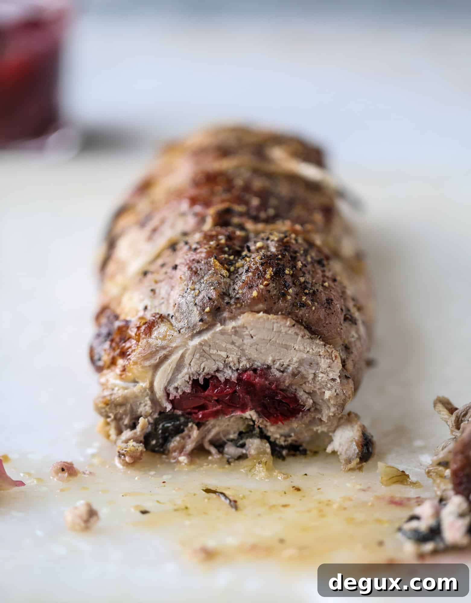 Holiday Stuffed Pork Tenderloin Recipe for Festive Dinners 4 This holiday stuffed pork tenderloin is filled with caramelized onion, fresh cranberry sauce, goat cheese and fresh spinach. It's a show stopper and super delicious, along with being fairly simple to make!