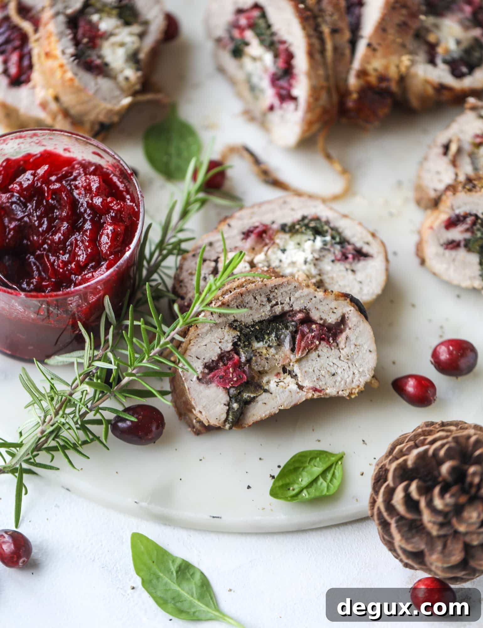 Holiday Stuffed Pork Tenderloin Recipe for Festive Dinners 10 This holiday stuffed pork tenderloin is filled with caramelized onion, fresh cranberry sauce, goat cheese and fresh spinach. It's a show stopper and super delicious, along with being fairly simple to make!