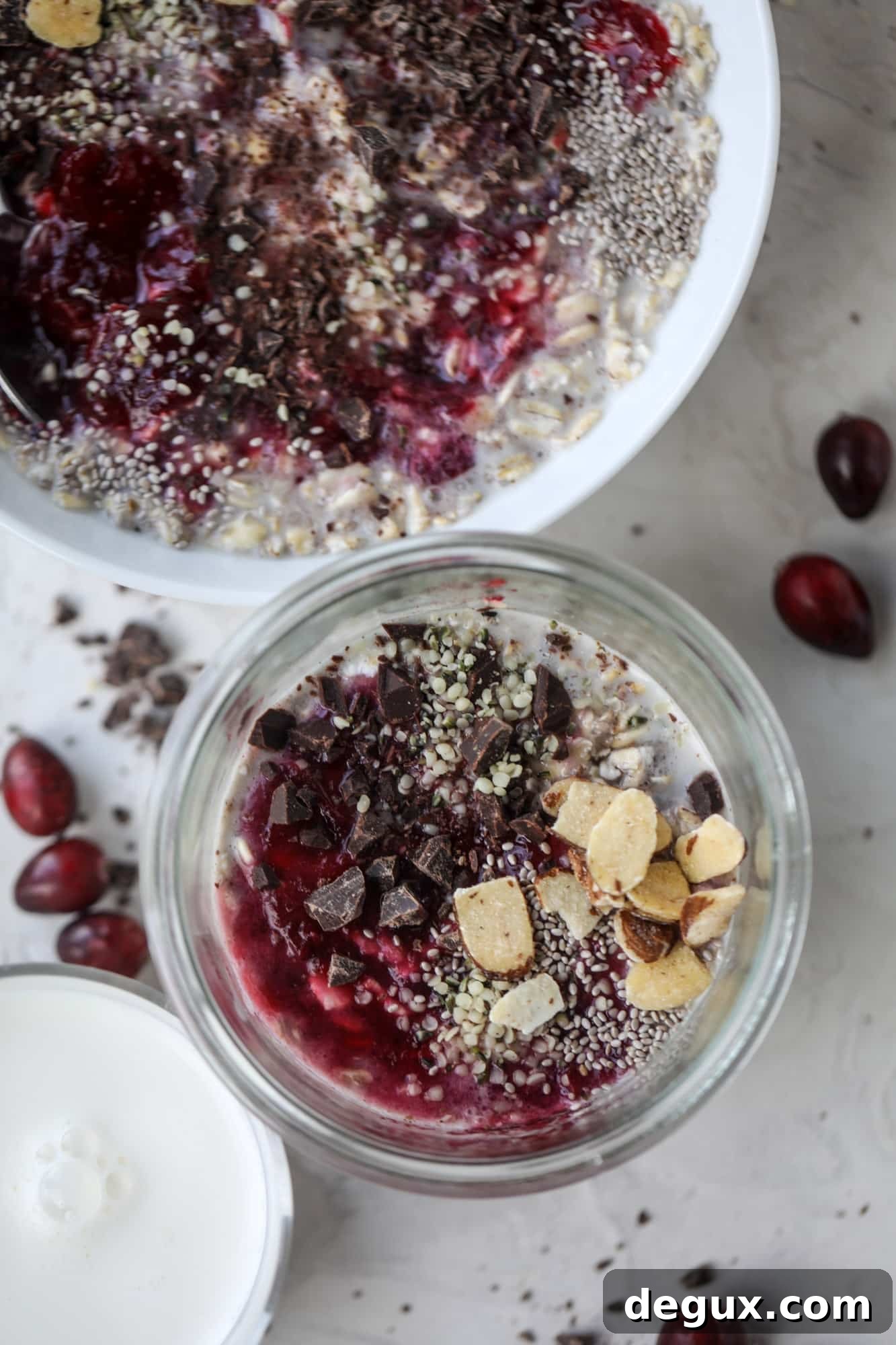 These leftover cranberry overnight oats are the perfect post-Thanksgiving breakfast! Leftover cranberry sauce and dark chocolate come together to flavor chewy, chilled overnight oats. Add on sliced almonds, chia seeds and hemp hearts for more deliciousness! I howsweeteats.com #overnight #oats