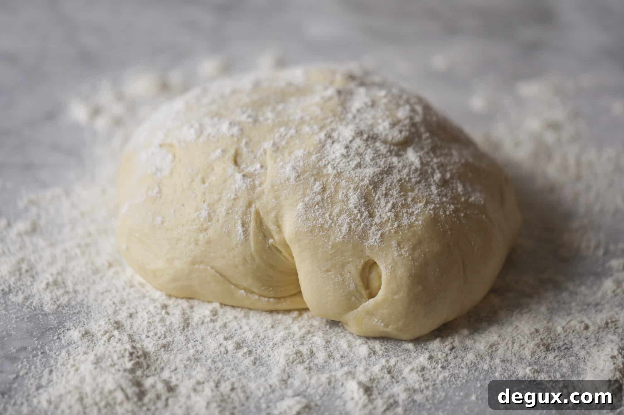 Garlic herb parker house rolls are full of incredibly buttery flavor! They are brushed with a garlic herb butter and are super fluffy, soft and tender. Perfect for Thanksgiving or the holidays and you can make the dough a bit ahead of time! I howsweeteats.com #parkerhouse #rolls