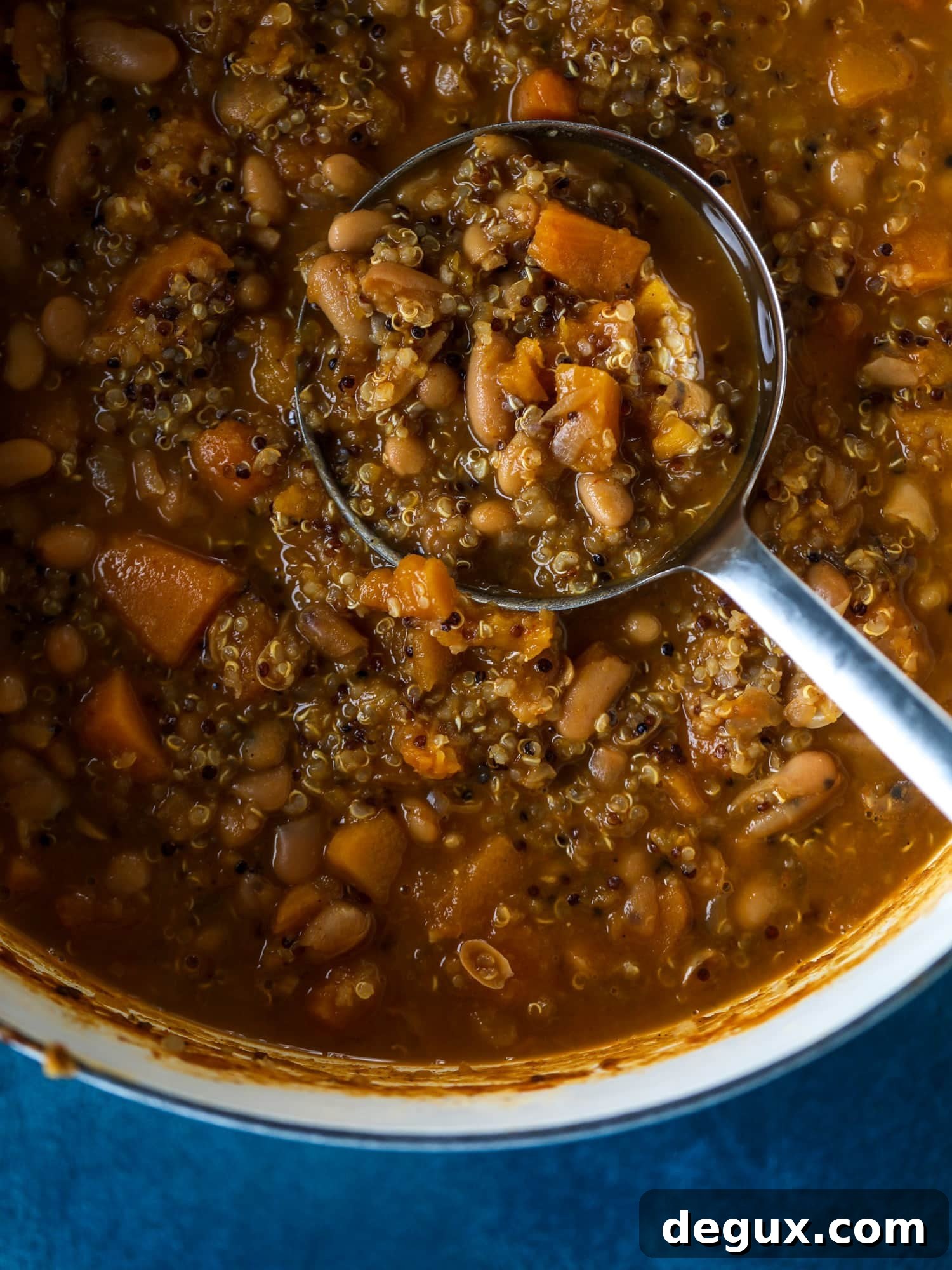 Hearty Butternut Squash and Quinoa Chili Recipe 4 This butternut squash chili is super satisfying and delicious! It's made with pinto beans and quinoa, comes together quickly and is filling and perfect to reheat for lunches. Everything you want in a vegetarian chili!