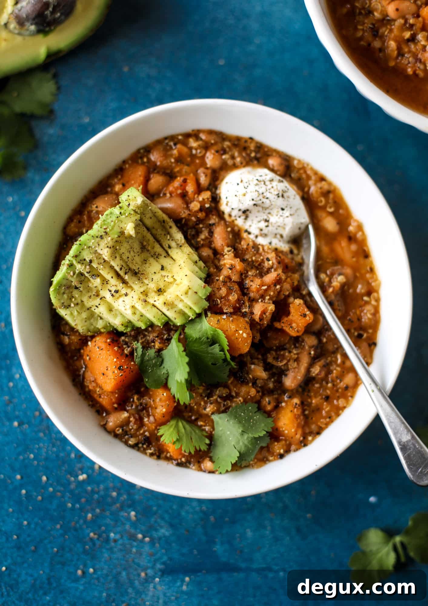 Hearty Butternut Squash and Quinoa Chili Recipe 6 This butternut squash chili is super satisfying and delicious! It's made with pinto beans and quinoa, comes together quickly and is filling and perfect to reheat for lunches. Everything you want in a vegetarian chili!