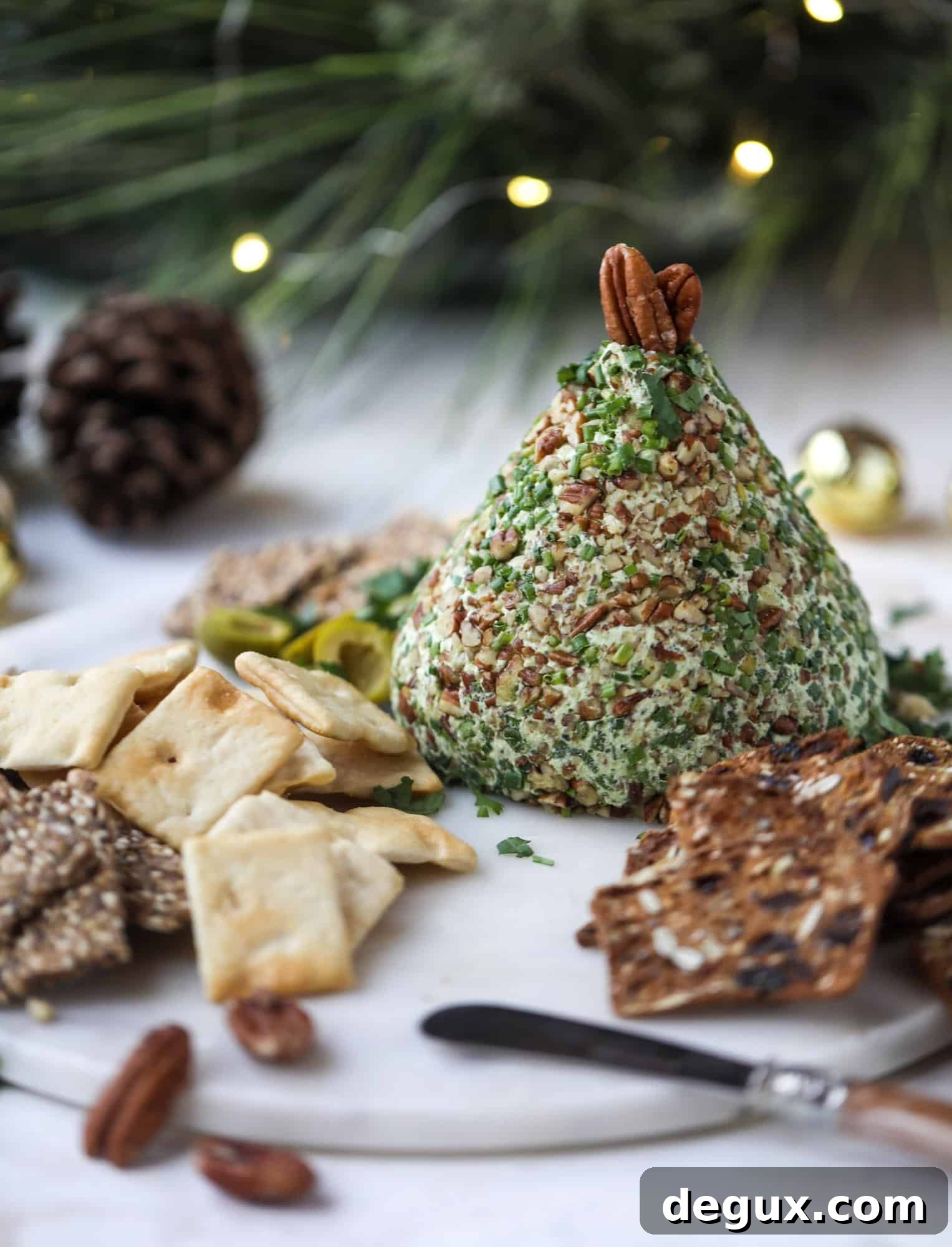 Creamy Green Goddess Cheese Ball Recipe for Parties 2 This green goddess cheese ball is the perfect party snack! You can make it ahead of time and shape it into a cute tree for a festive look. Serve it with crispy crackers and pita chips!