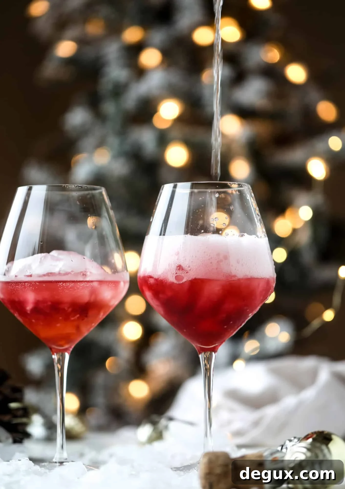 This winter aperol spritz cocktail is a seasonal spin on the classic aperol spritz! Festive cranberry and classic orange come together with prosecco and club soda to create a super light and refreshing cocktail for the holidays! I howsweeteats.com #aperol #spritz