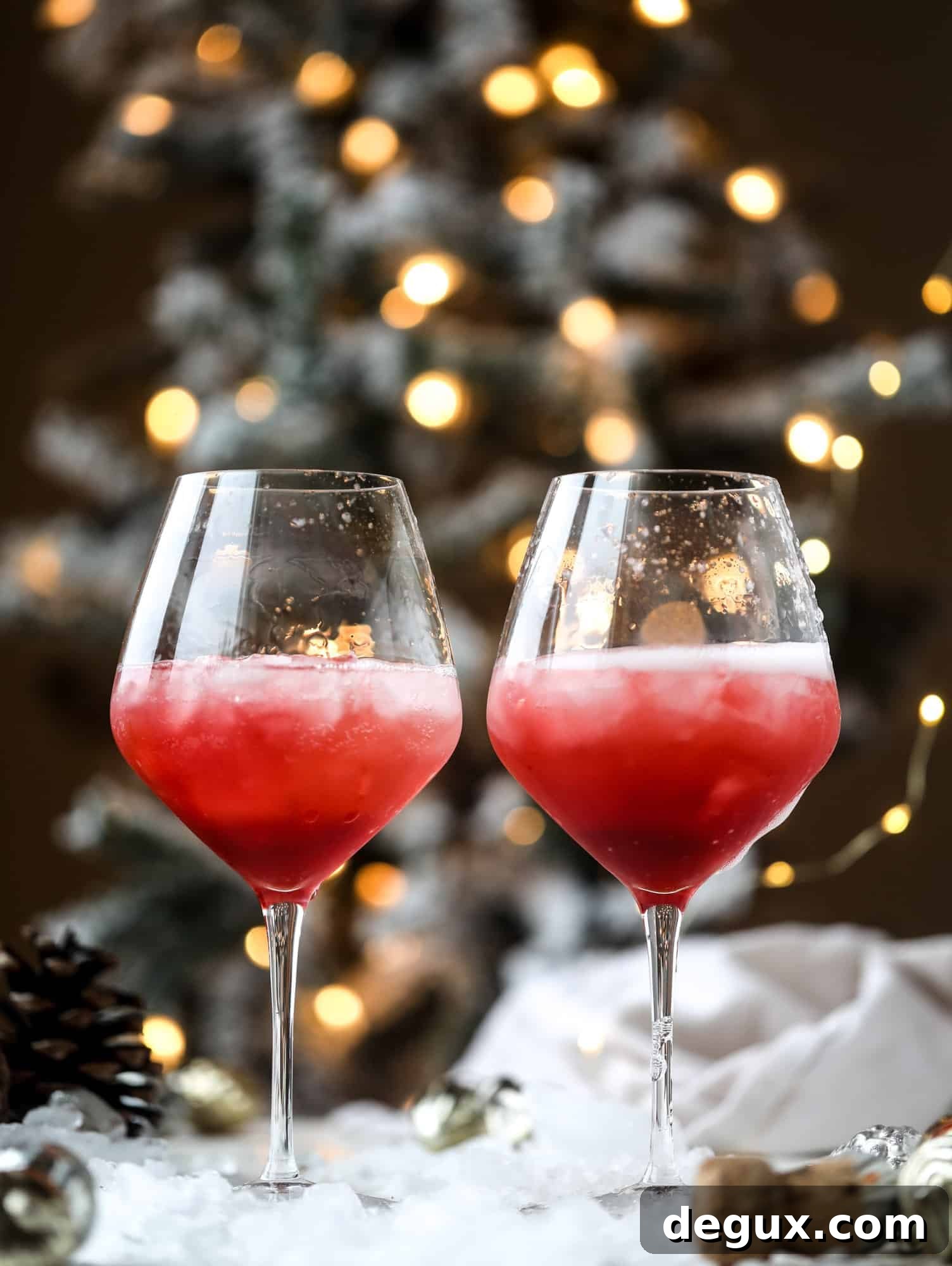 This winter aperol spritz cocktail is a seasonal spin on the classic aperol spritz! Festive cranberry and classic orange come together with prosecco and club soda to create a super light and refreshing cocktail for the holidays! I howsweeteats.com #aperol #spritz