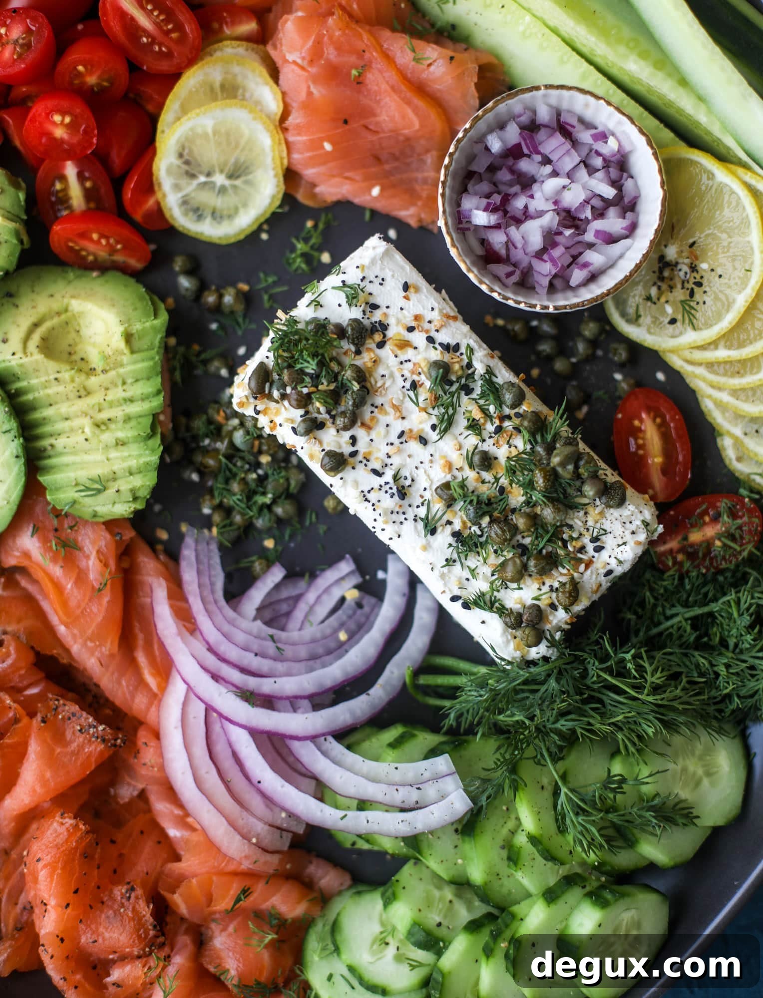 This is my favorite way to make an incredible smoked salmon platter! Fresh smoked salmon with bagels, soft boiled eggs, cream cheese and capers, everything seasoning and so much more. Perfect for holiday breakfasts and brunches! I howsweeteats.com #smokedsalmon #platter
